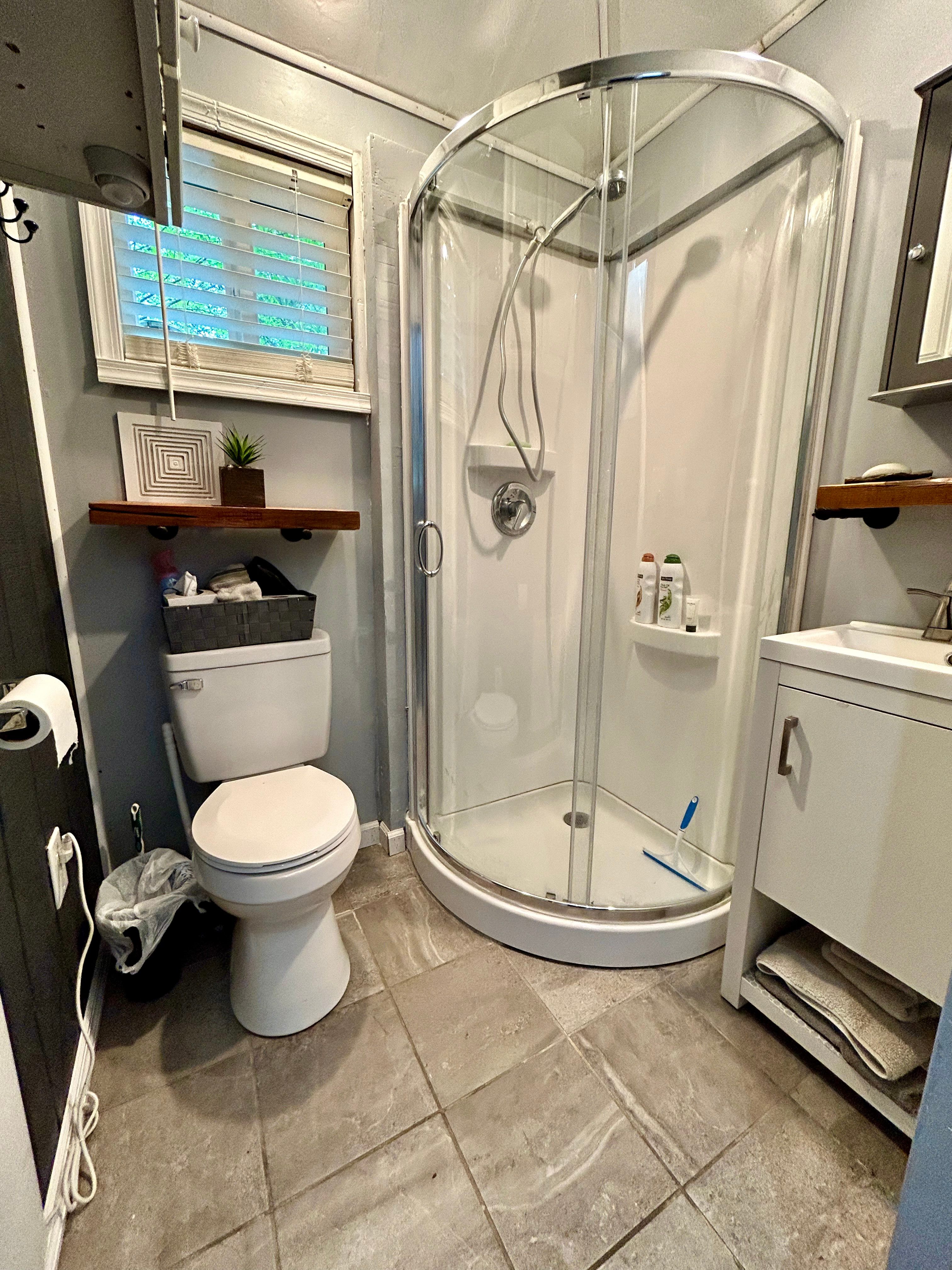 Bathroom with hot/cold shower, sink, etc..