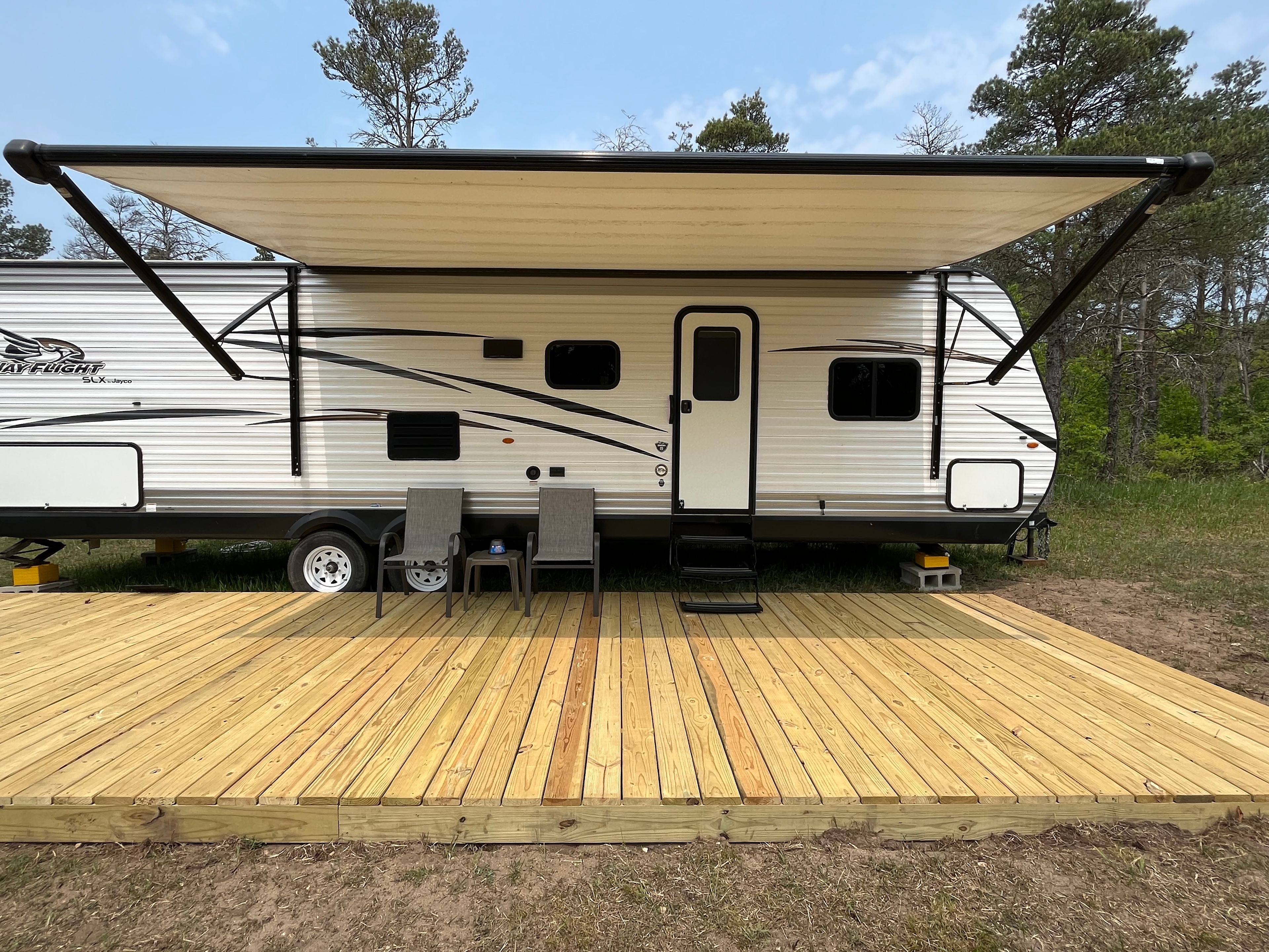 Private campsite with camper