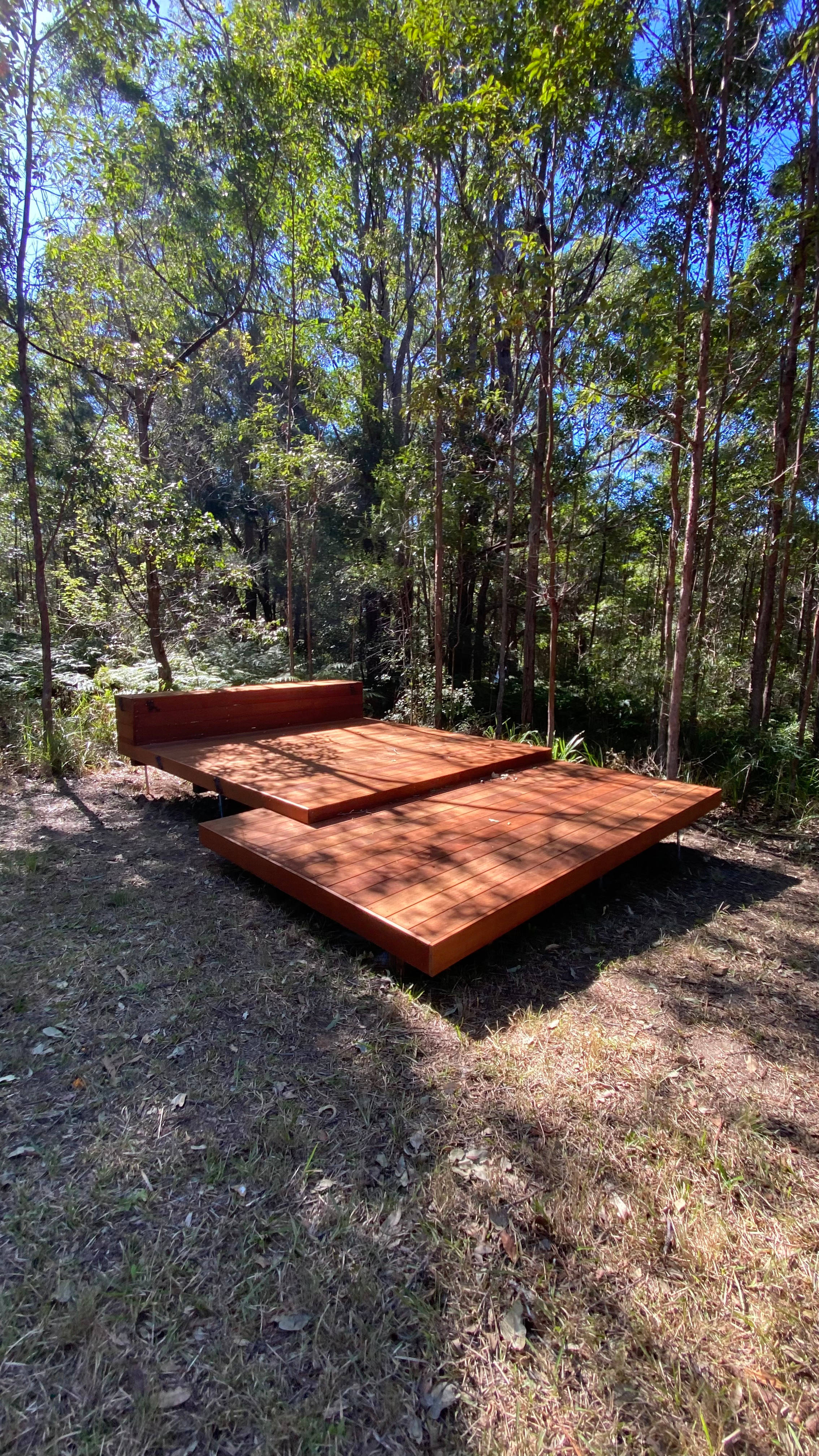 beautiful decking surrounded by trees for pitching your tent 
there is also grassed area around to pitch your tent
