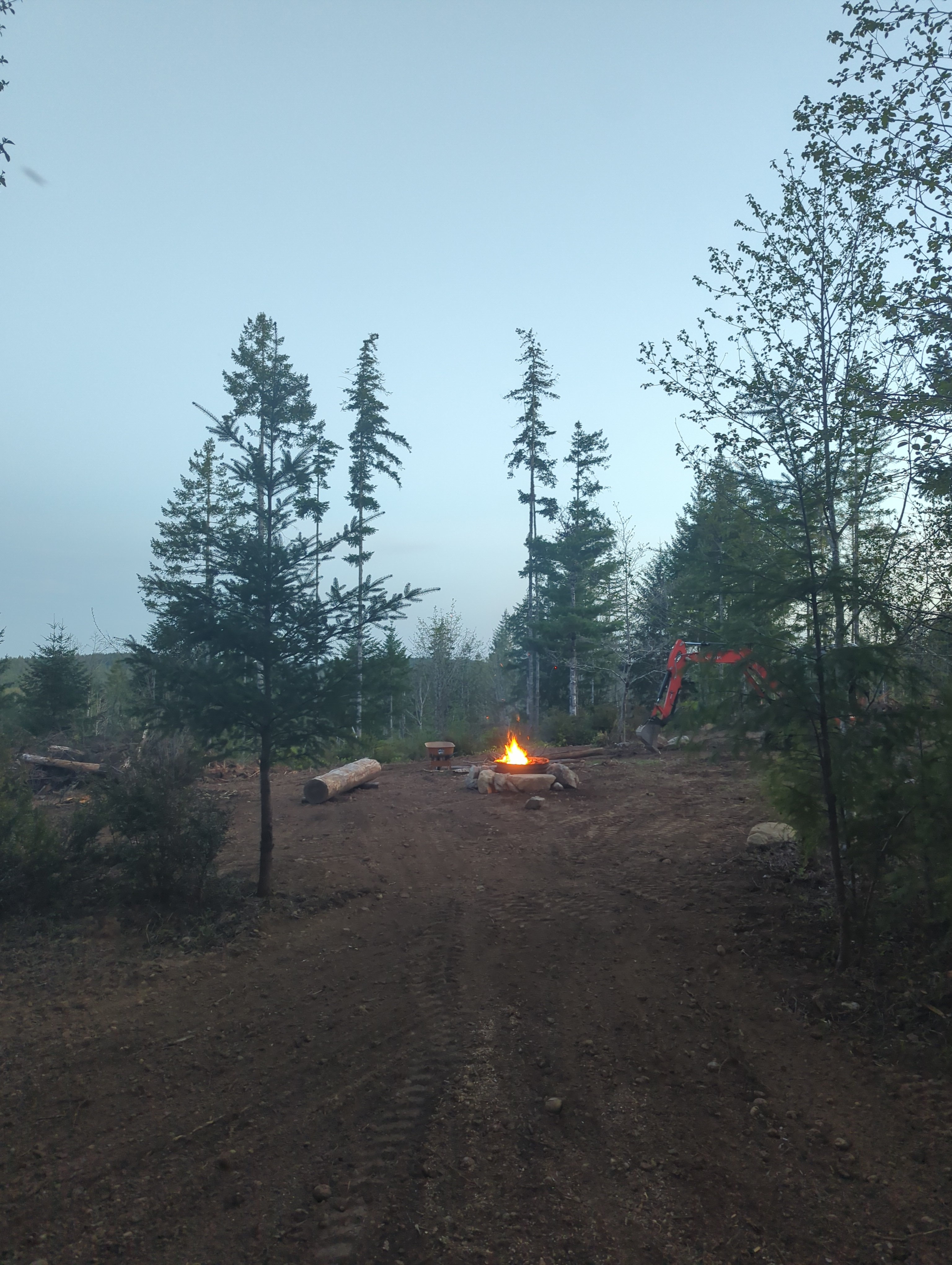 Late winter 2023, Valley lookout, View south, heavy clouds, late evening. Just after lighting the first fire in the new fire pit.  See recent photos for changes in vegetation and development.