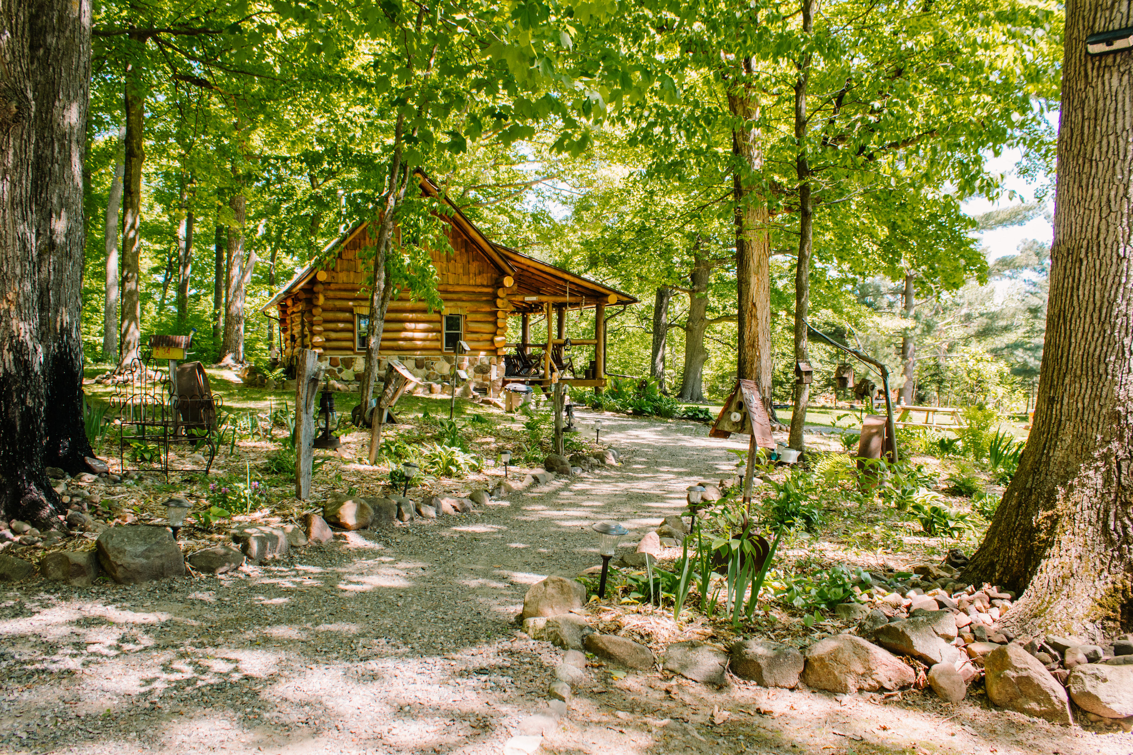 Waking from the Sugar Shack to the Cozy Cabin. The landscaping is beautiful! Look for the gnome in the base of one of the trees to the left of the cabin. 