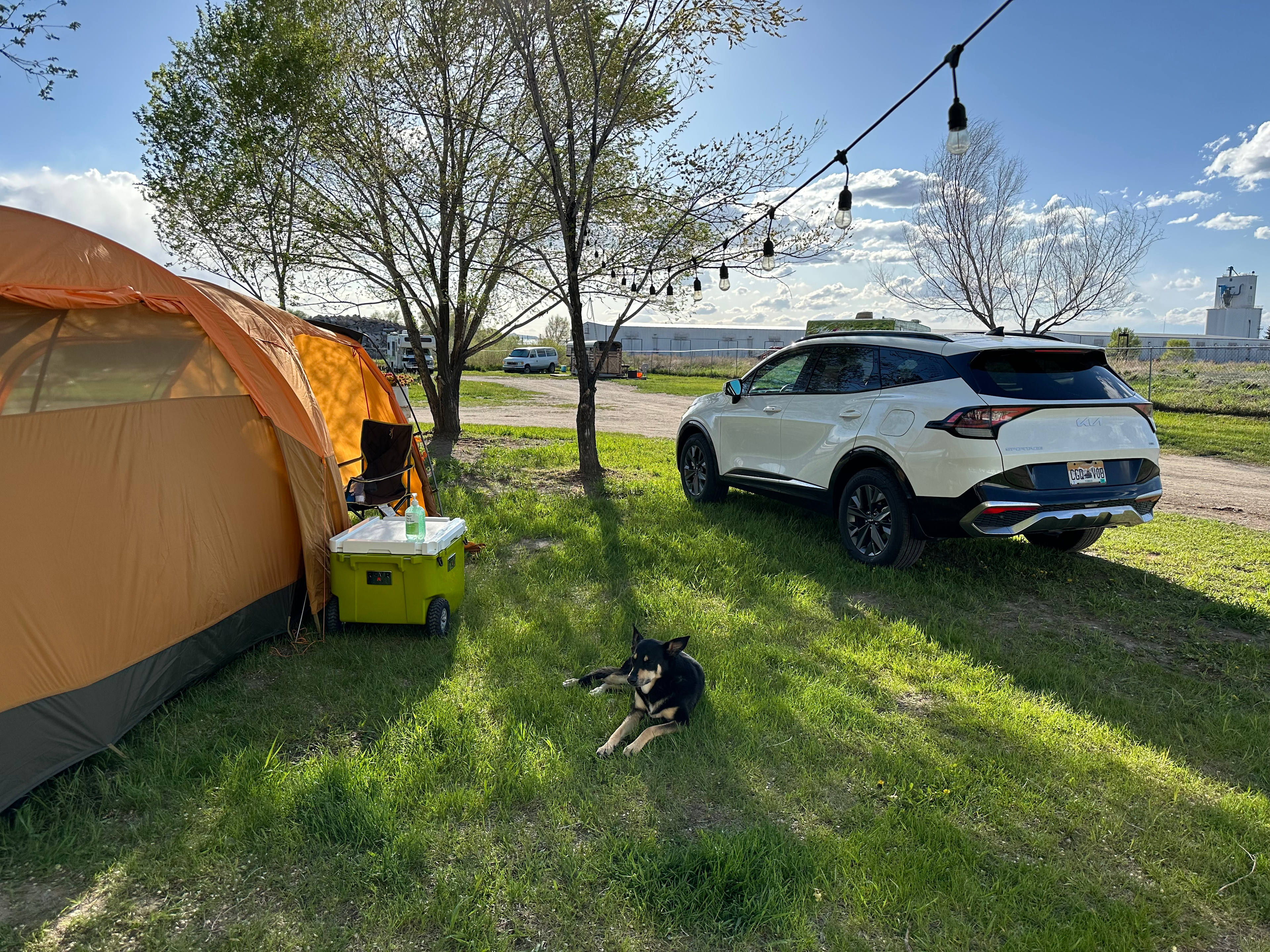 Best tent site with string lights, right near the gate