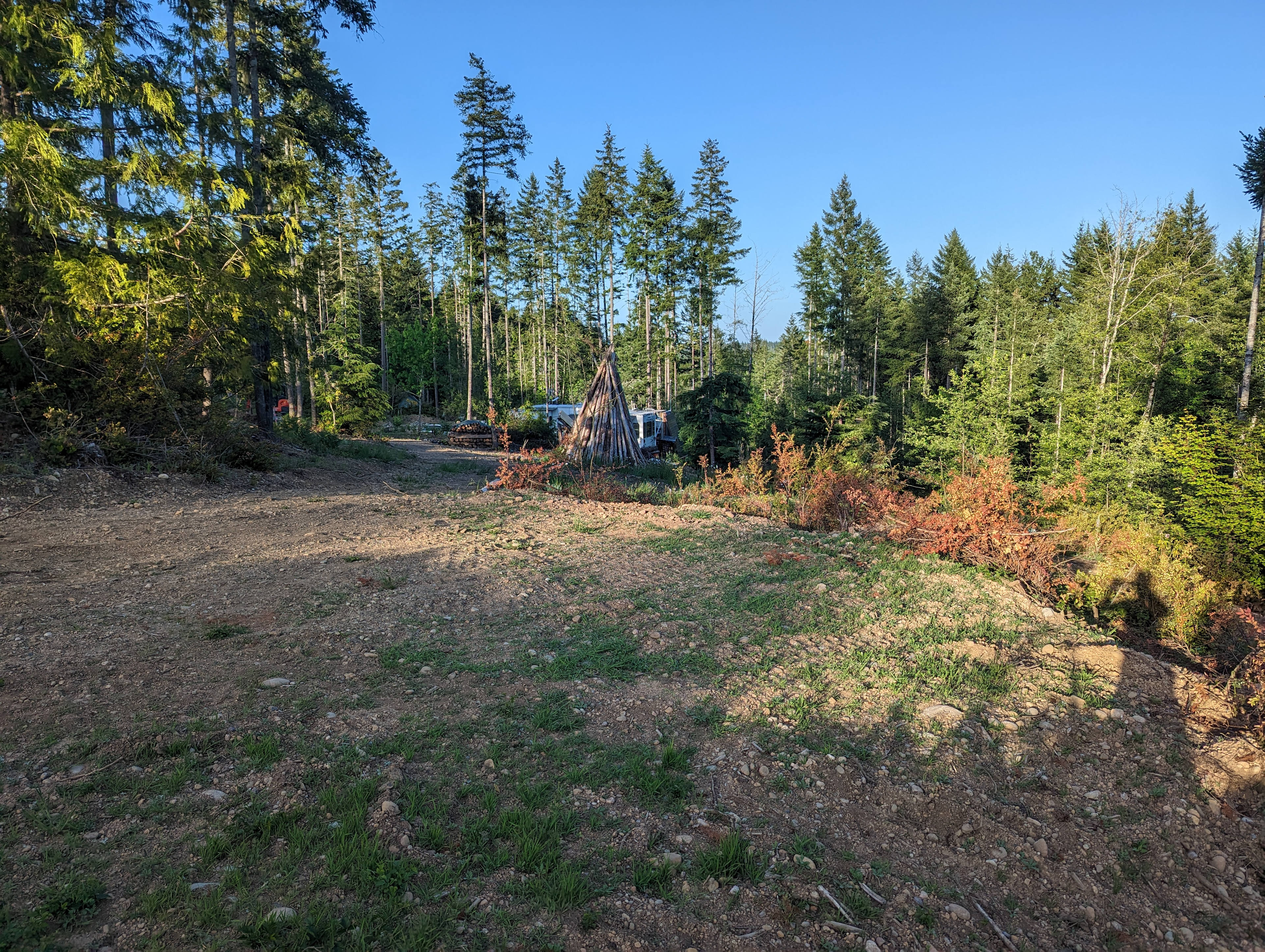 West Perch camp Site, View East, Clear June Sunset. To the left of that huge burn pile is the path use for access.