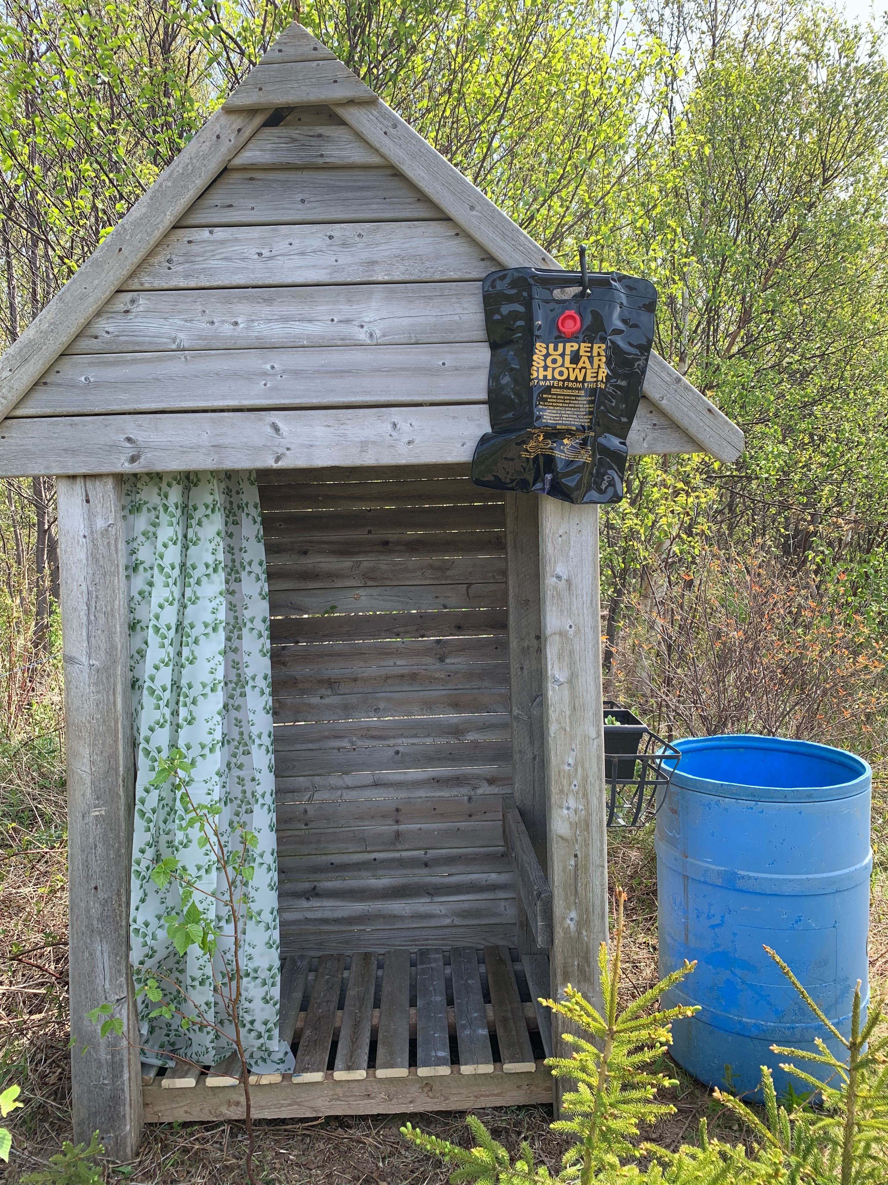 Solar shower (5 gallon) short walk (approximately 100 m) from tent site