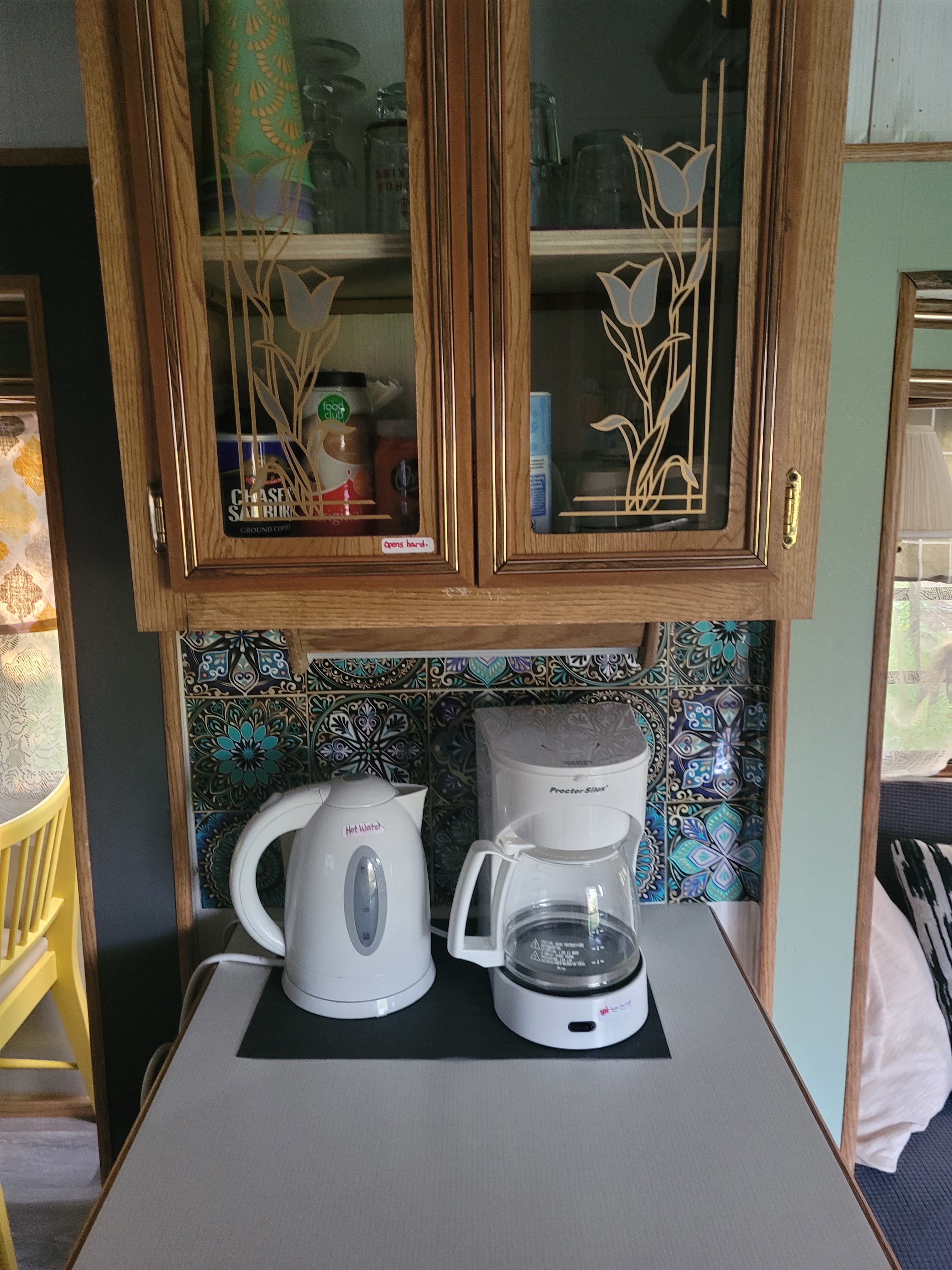 Coffee and tea station! All supplies are in the cabinets. It has a strong magnet door, so pull to open. 