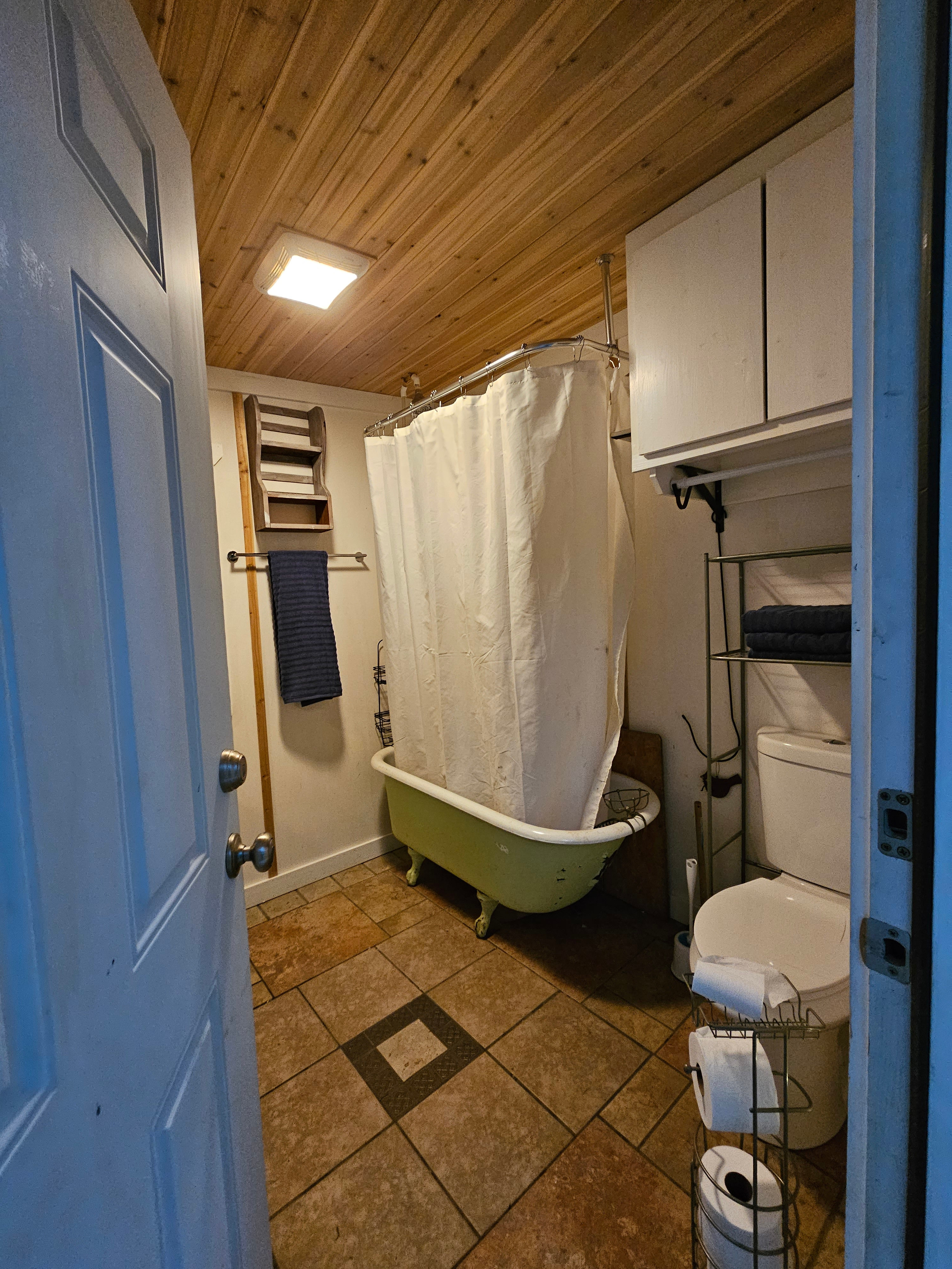 Inside the TajMaPotty. Clawfoot tub/shower