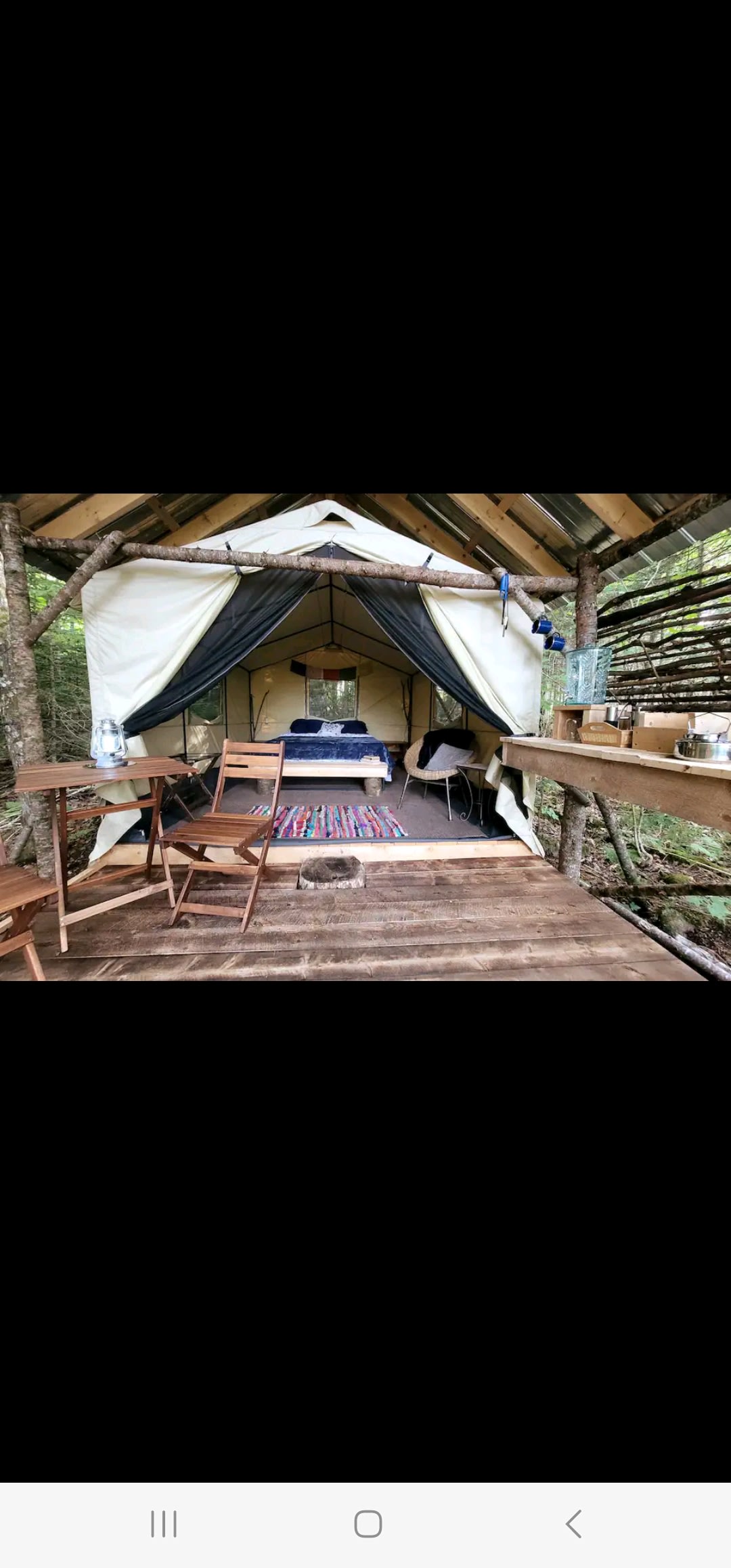 The cozy, covered cedar deck of the Birch Tent