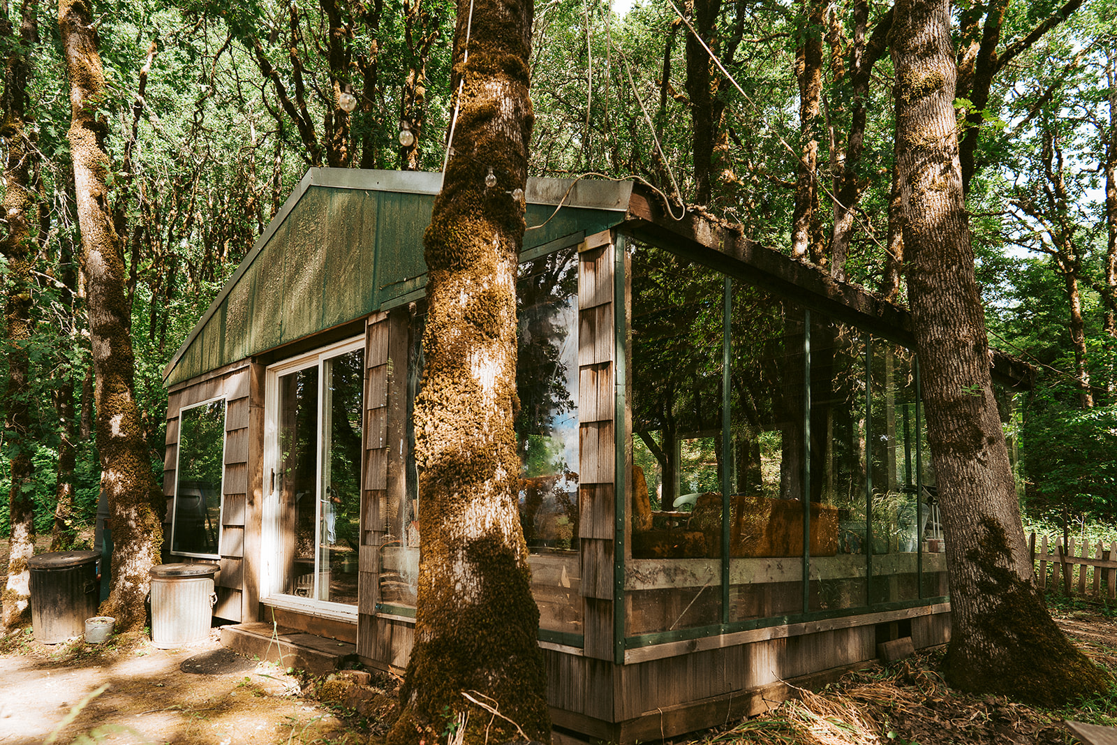Exterior of the glass house where. This is where the communal fire pit is located as well