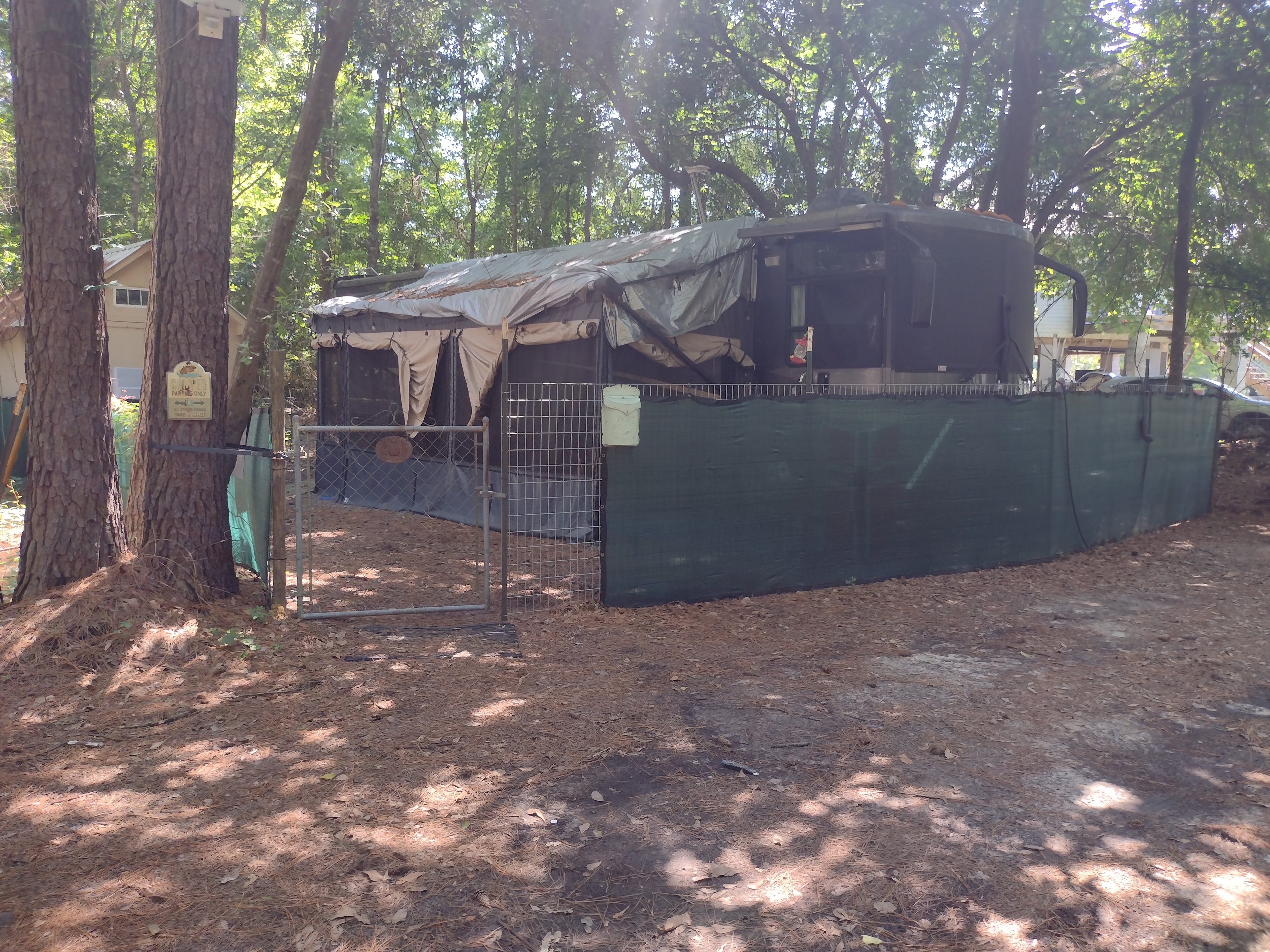 Fenced camper spot + 2 car parking spaces in front of fence 