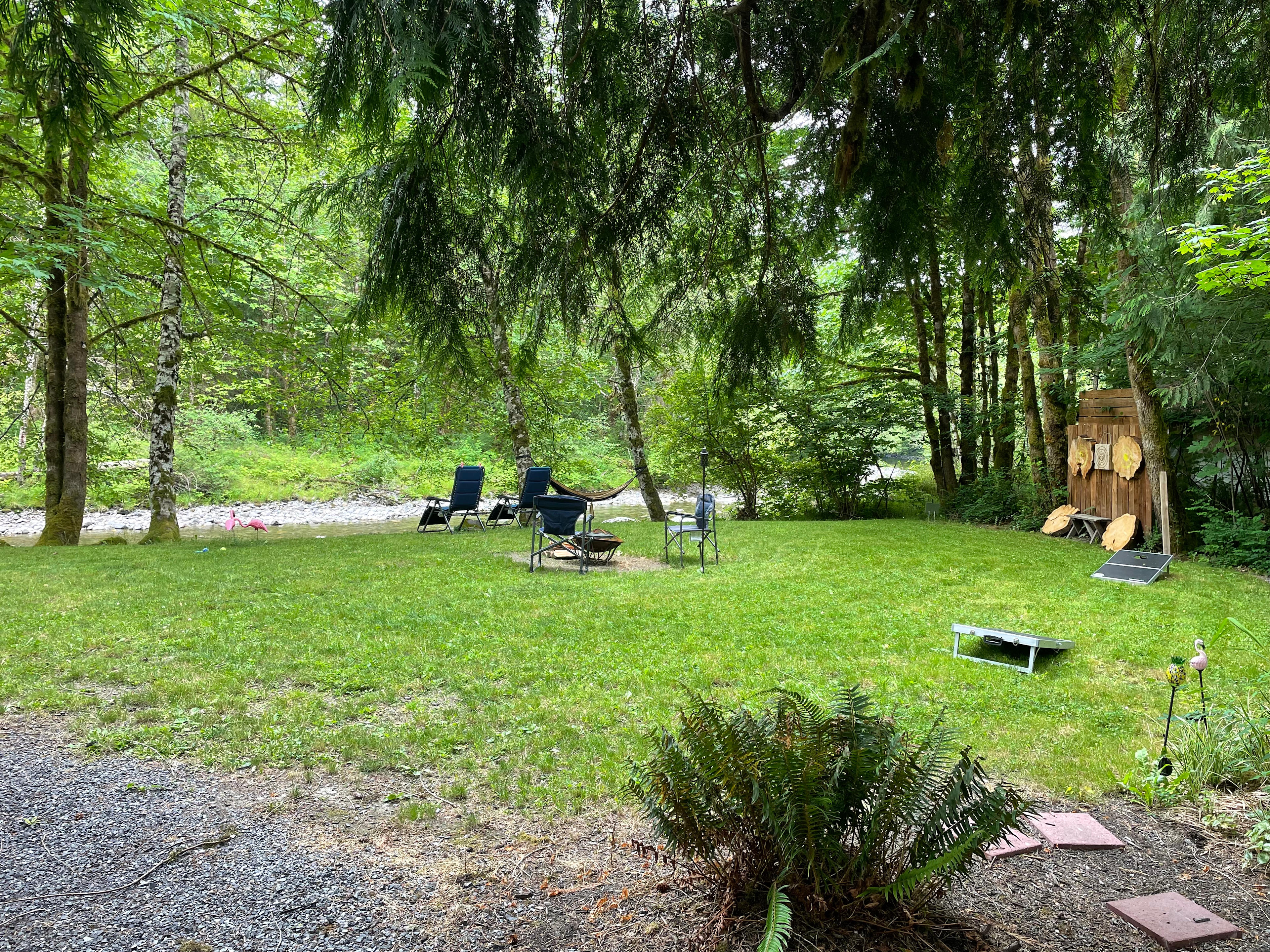 Grass area to relax all day by the river playing supplies games 