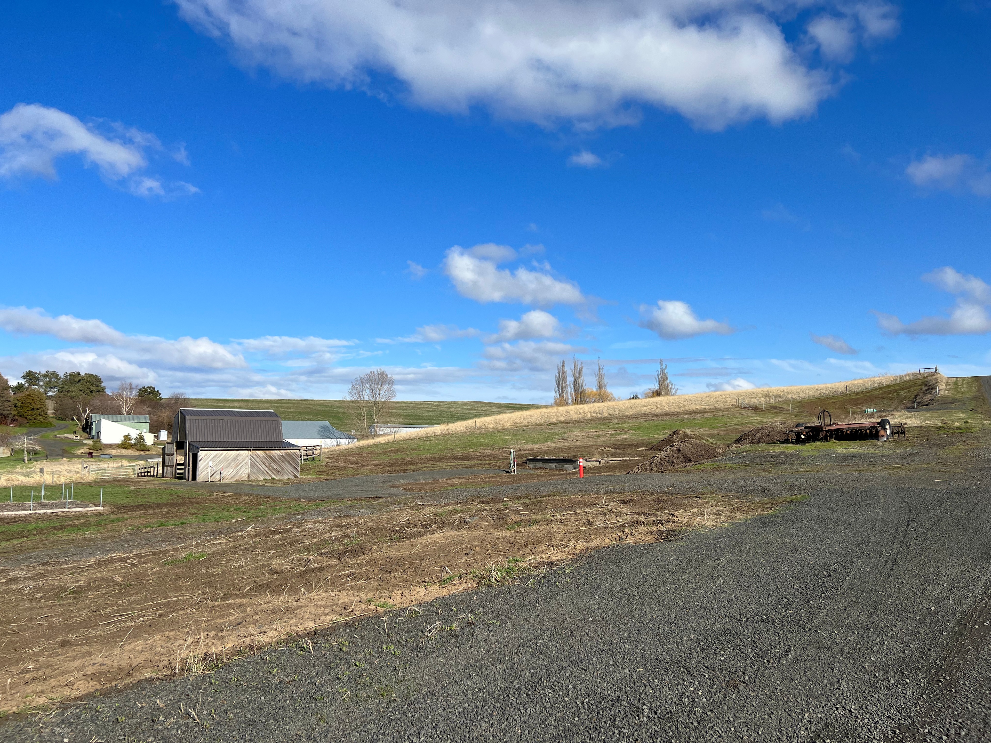 Left turn after grey shop: spot is on the right before the barn