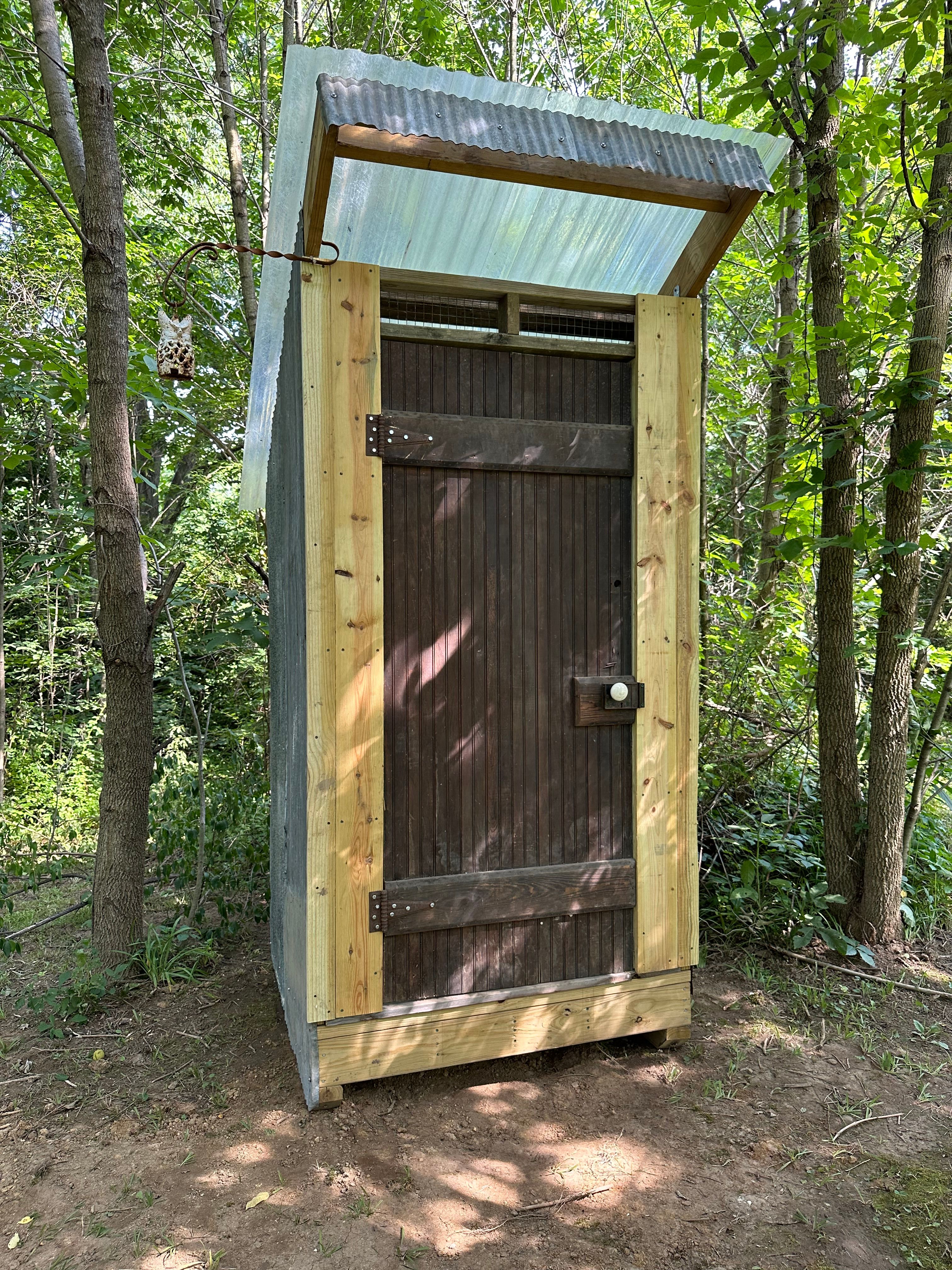 Communal outhouse for all sites.
