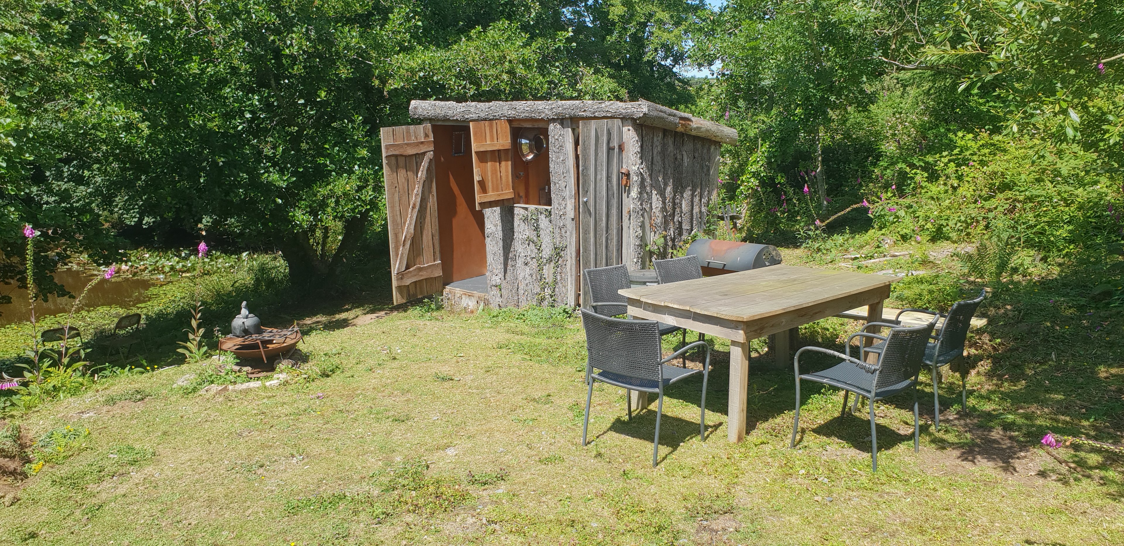 kitchen and shower hut and table area