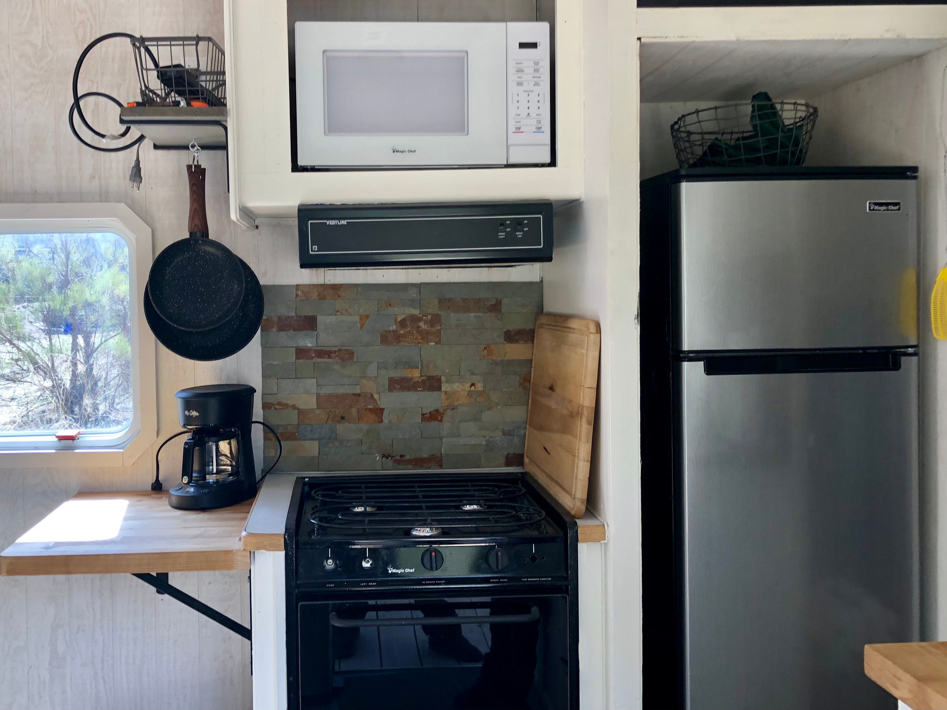 Refrigerator, coffee maker, coffee, tea, hot chocolate, cream and sugar provided