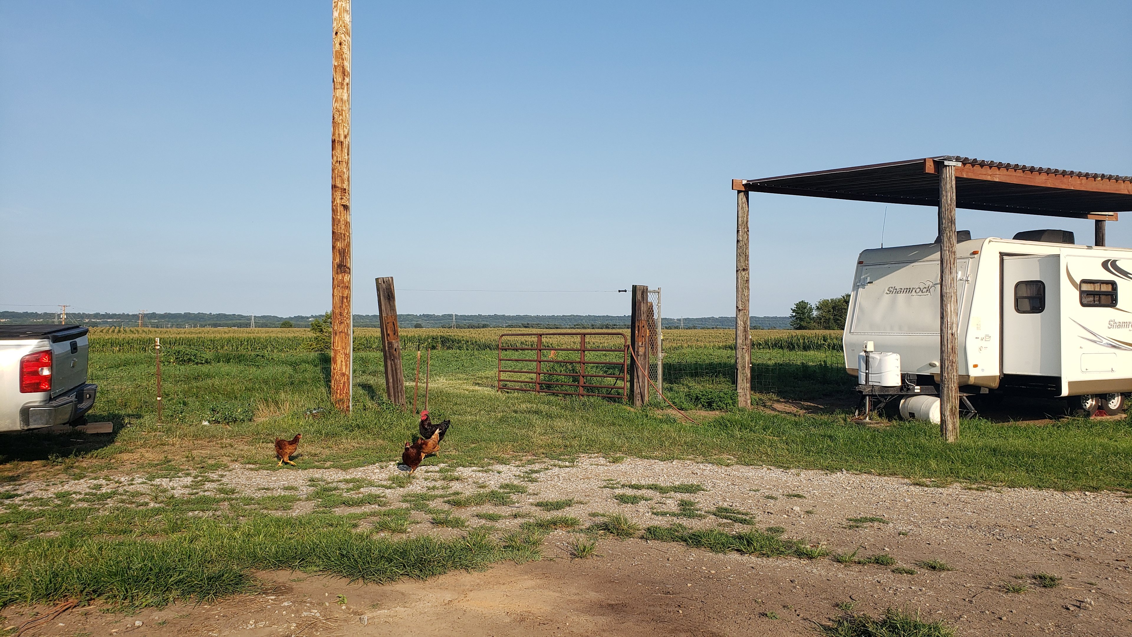 You will pull around the circle drive and go through this gate into the pasture. The gate has been increased to 20 feet wide which provides for easy access even for an inexperienced driver!

The camper in the pictures is ours.  No one will be staying in the camper during your stay.