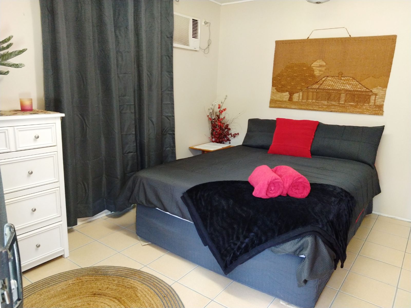 Master bedroom has a queen size ensemble in it , a set of drawers if required, it also has a reverse cycle air conditioner and ceiling fan. 