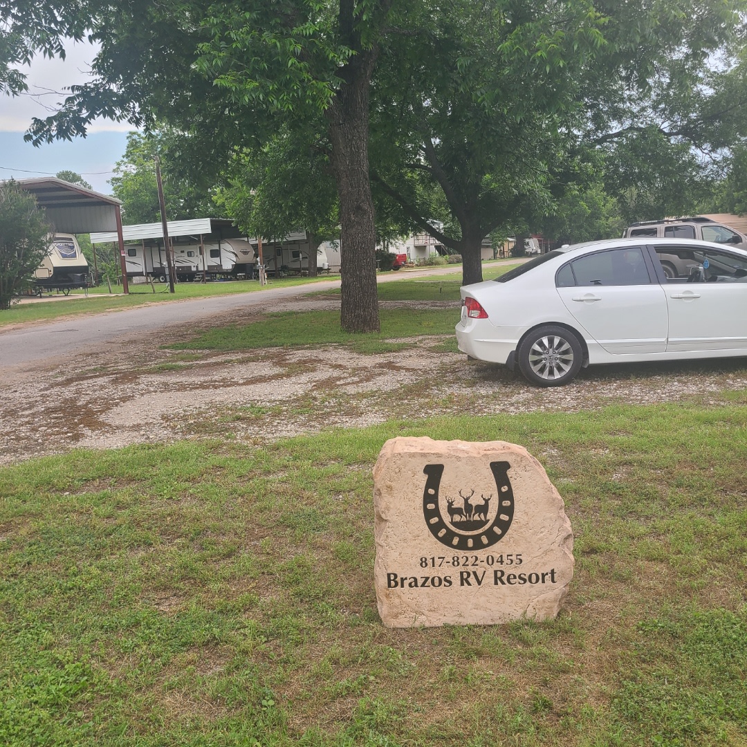 There are boulder signs at each end of the resort.