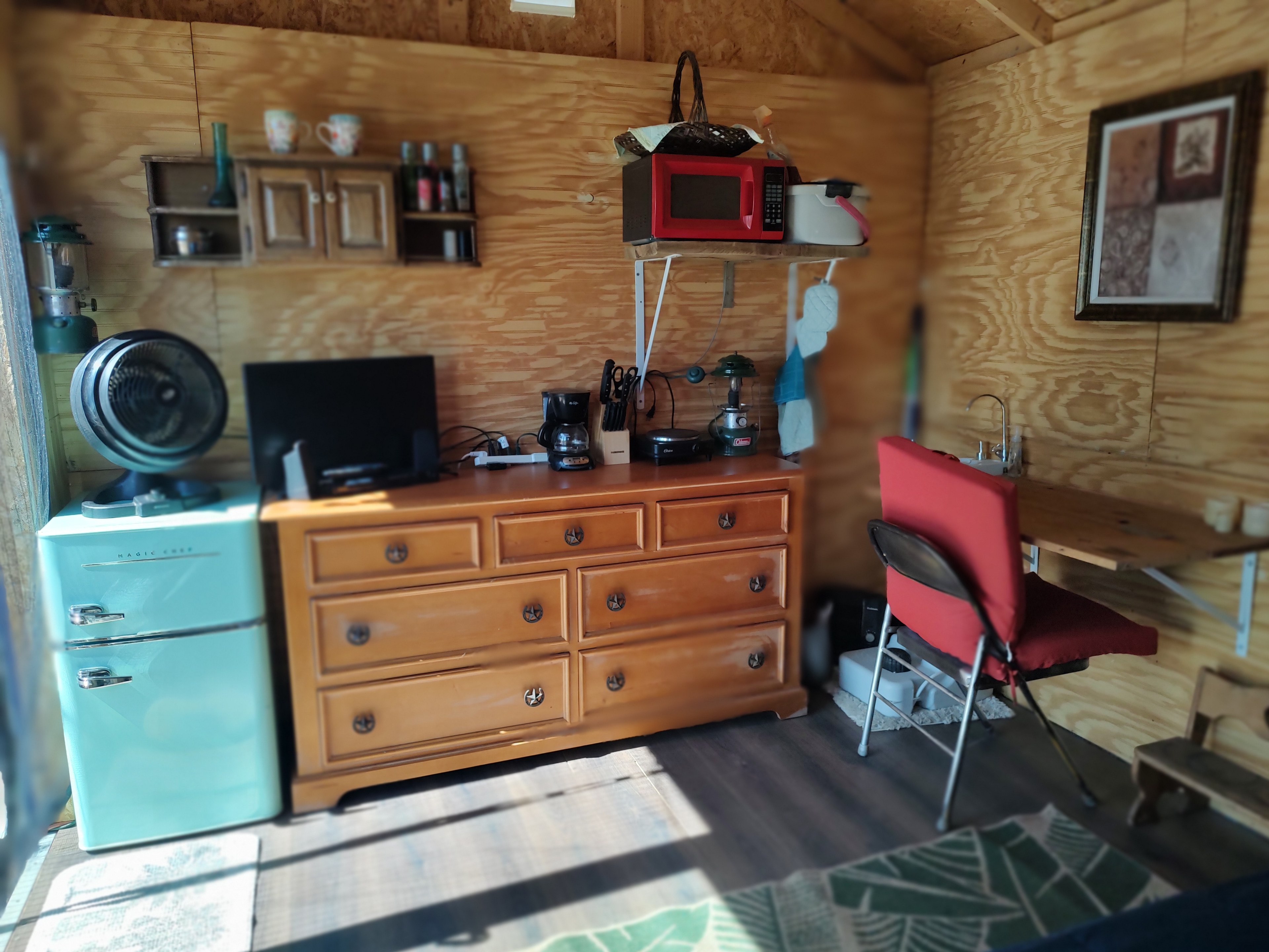 The amenities provided.  The cabinet has silverware, utensils, heat plate, microwave, pots and pans and towels. 