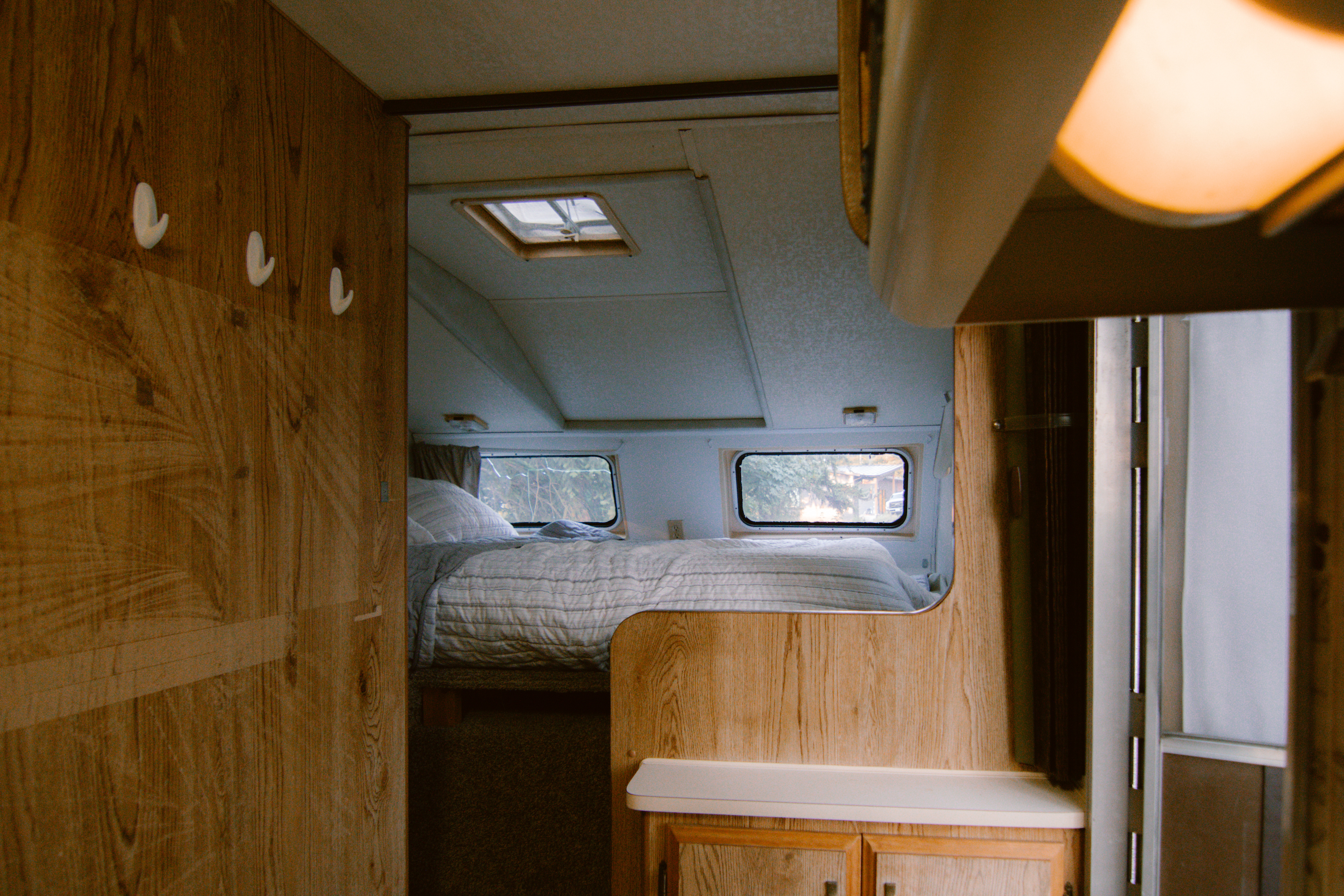 Bedroom space tucked in the front of the trailer.