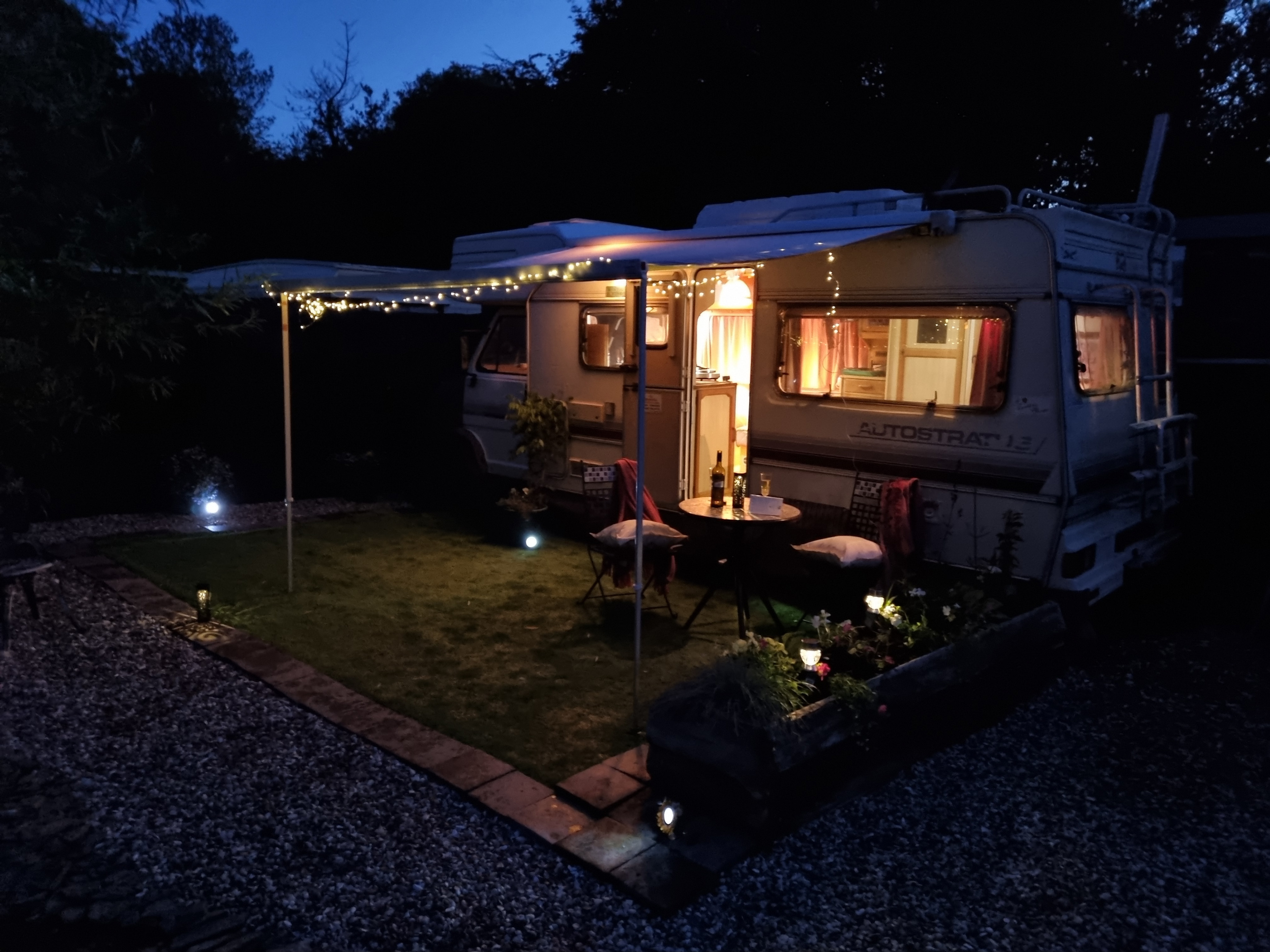 The evening patio area, with soft lighting.
