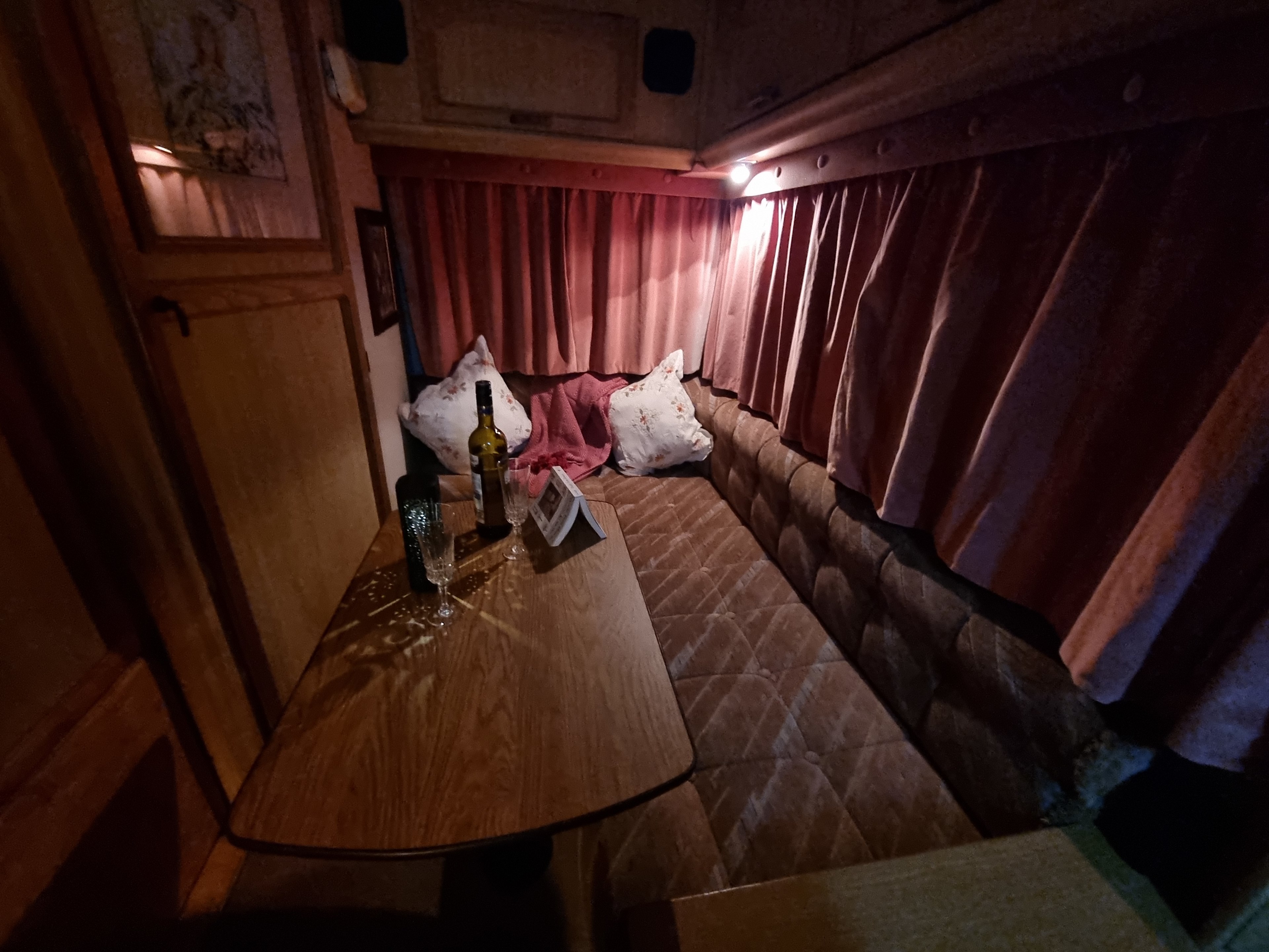 The cushioned lounge seat to relax on and have a read and drink at.