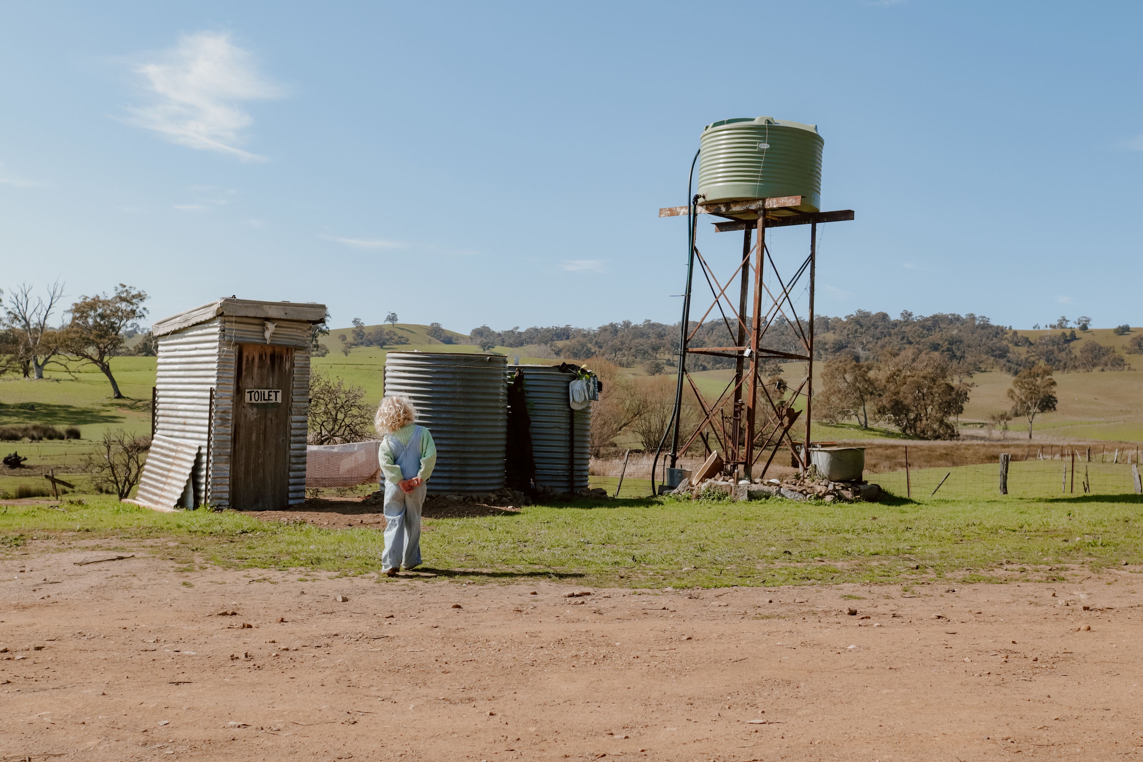 Outdoor showers and flushing toilet.