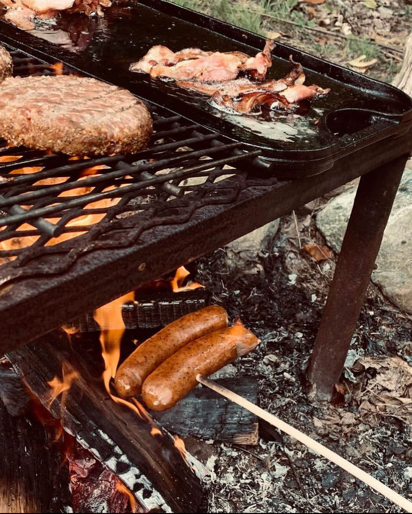 Cook over the small fire pit or there’s a propane grill