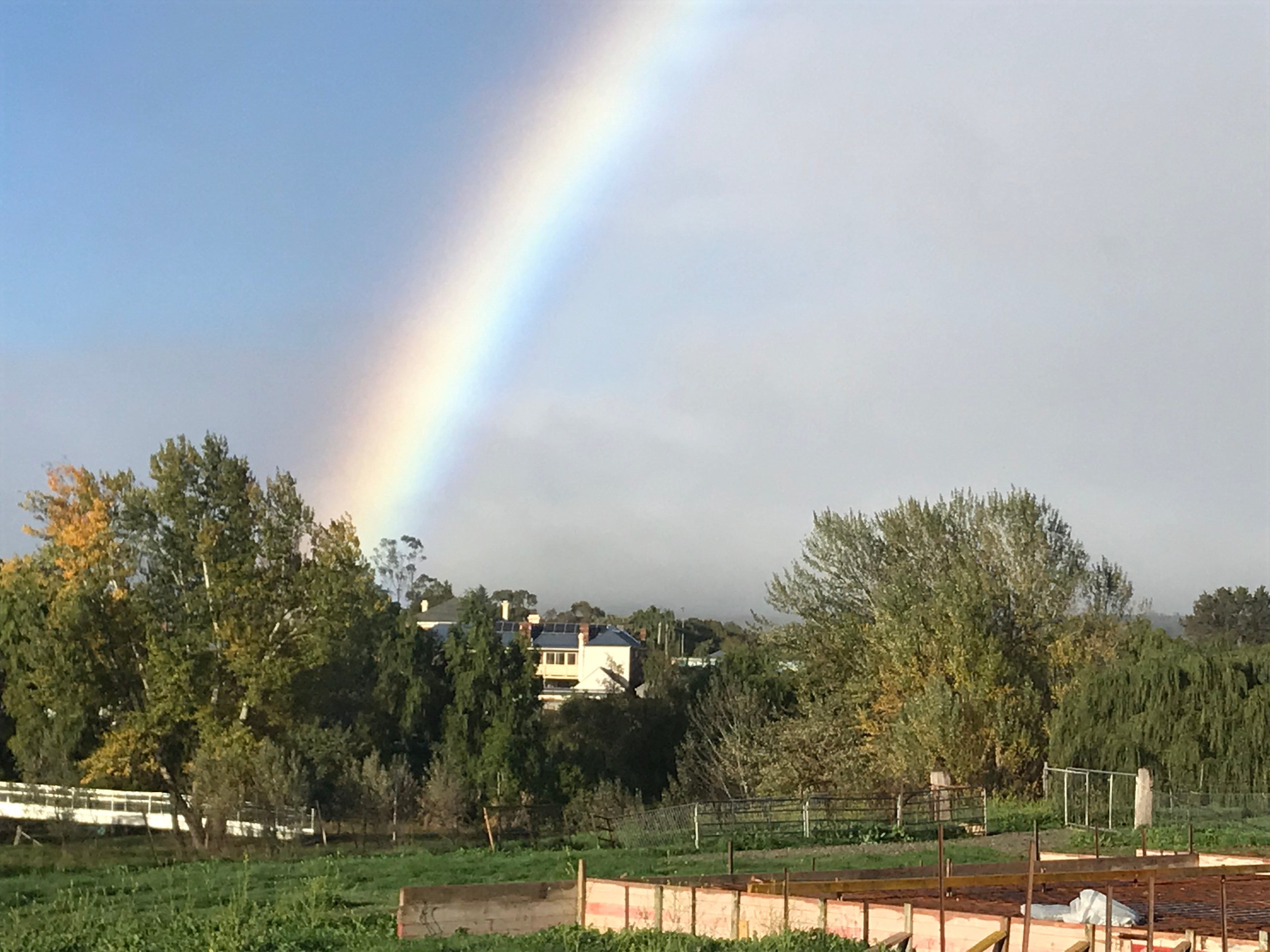 Two minutes walk across pedestrian bridge to cafes and boutique shops