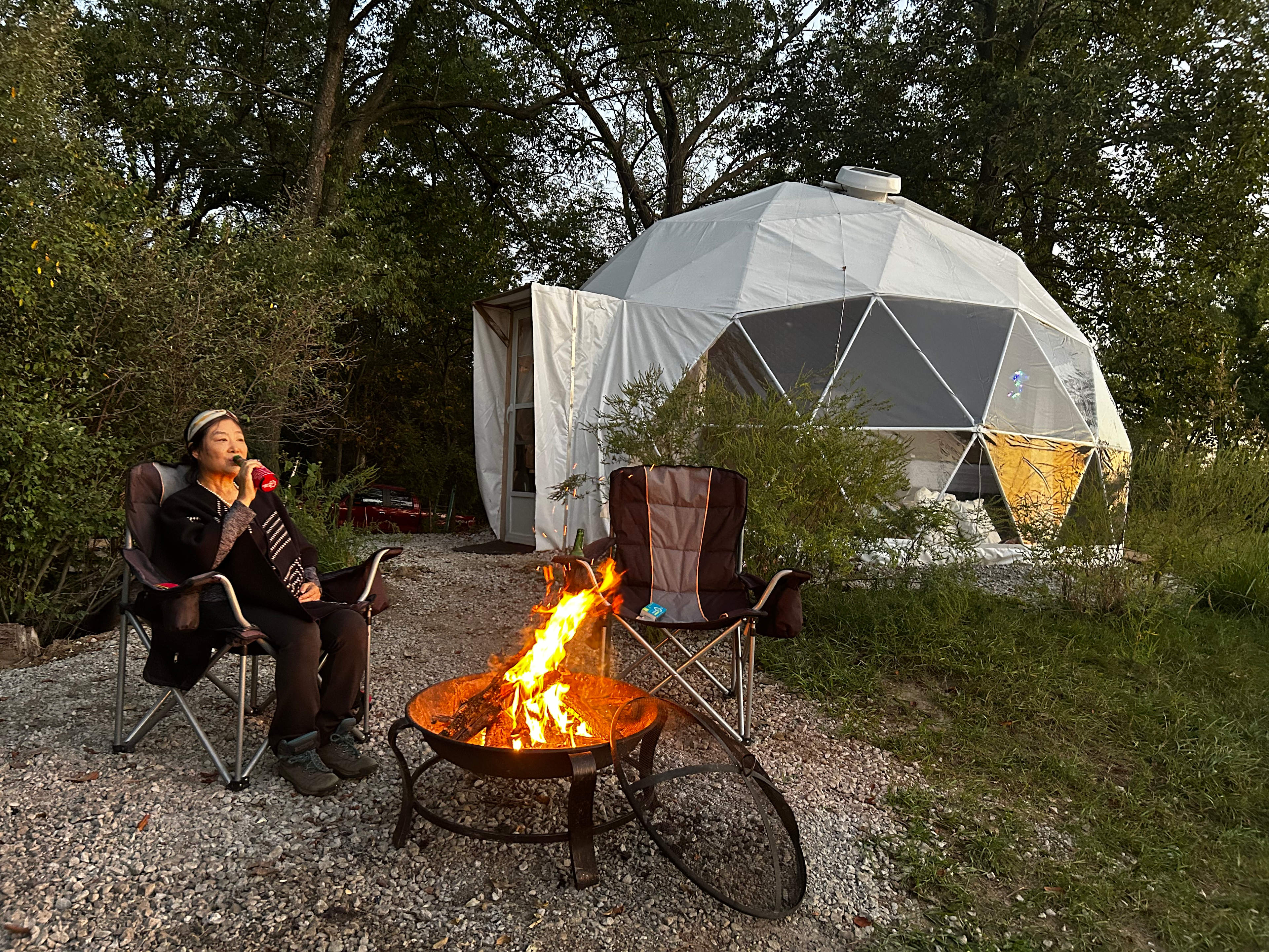 Out side the dome portable fire pit. A perfect spot to watch sunsetting.
There is an additional sitting area behind the dome with another fire pit and picnic table. Additional spaces behind the dome for hammocks car parking etc.