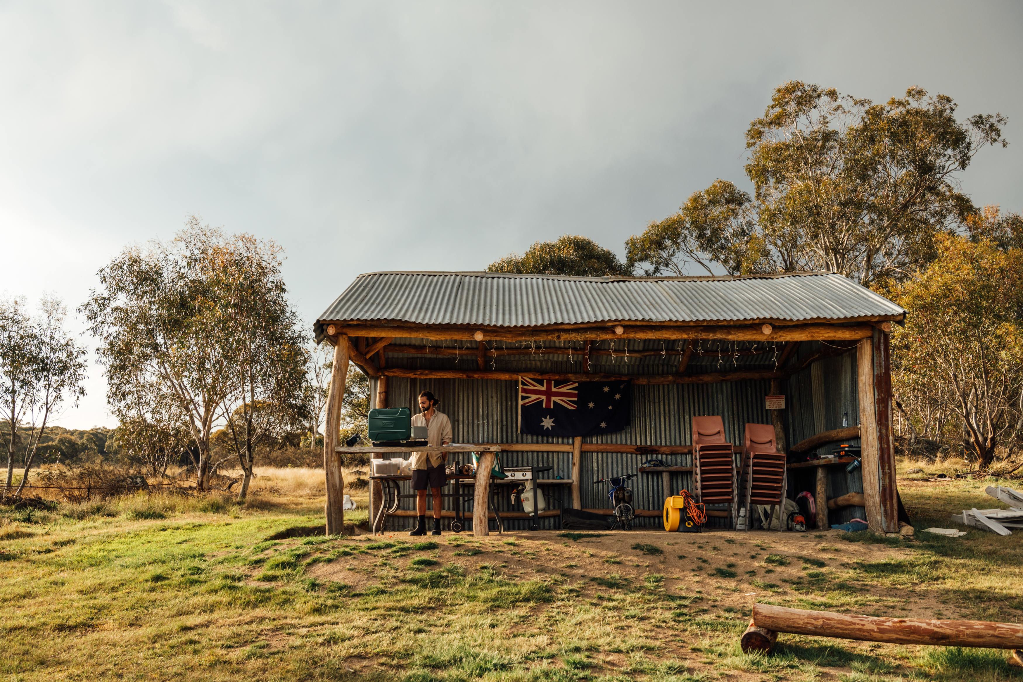 The covered kitchen space, has a few tables and a grill! 