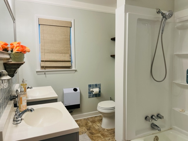 Main bathroom with tub/shower combo, double sinks and room to get ready for your day 