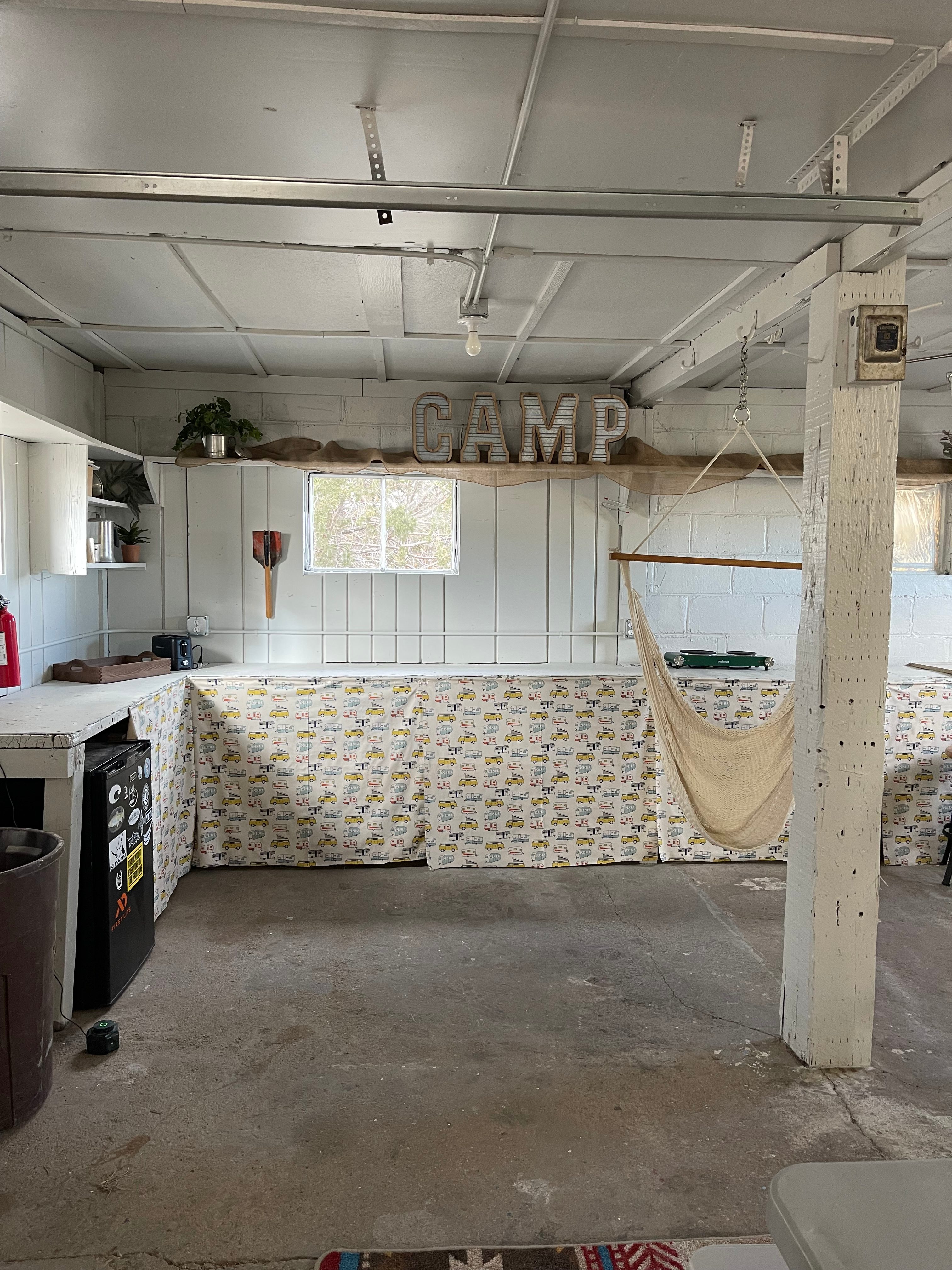 Refurbished interior for shelter.  Toaster, water for drinking or cooking and electric cook top