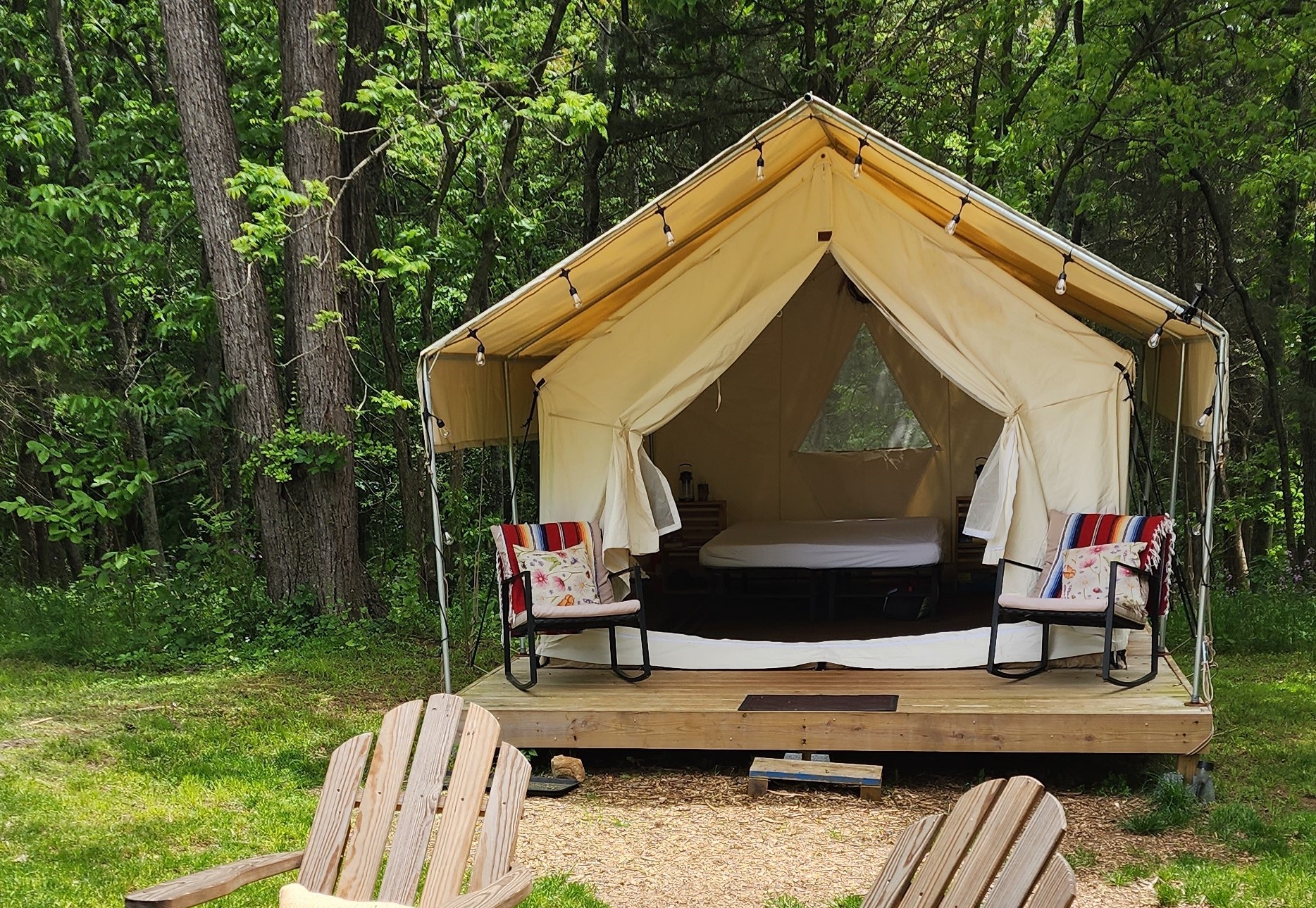 We outfitted our platform tents with a covered porch for protection from rain and sun. A perfect place for morning coffee!