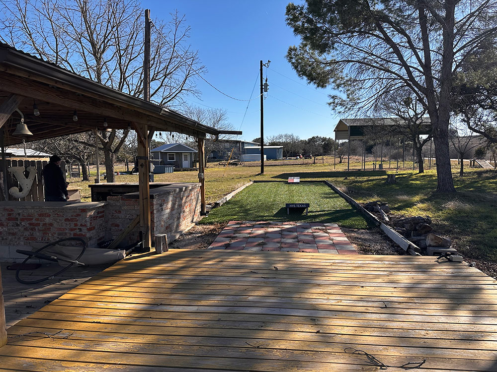 Deck and sport court facing covered RV spot (winter)