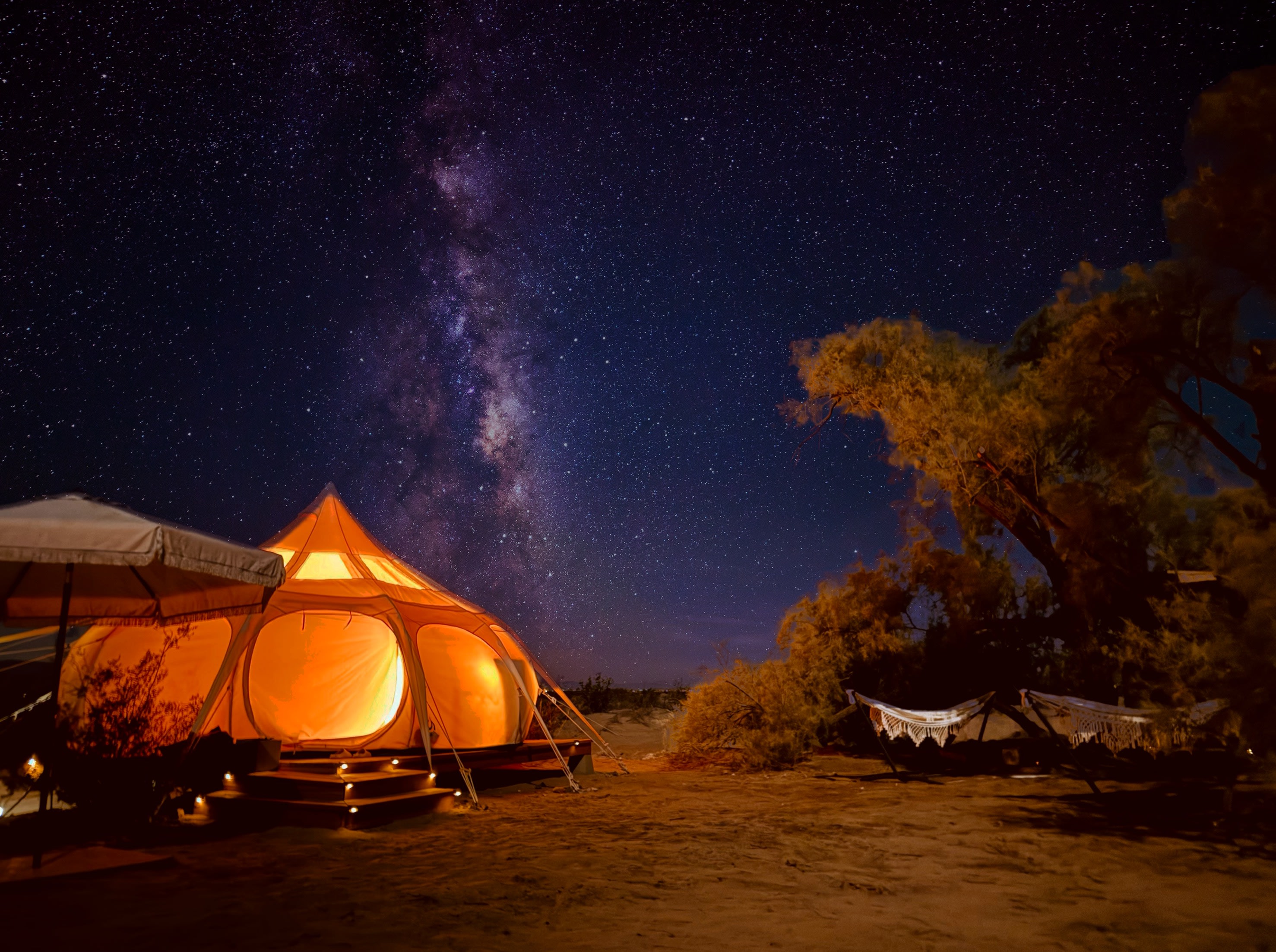 Lay under the stars on the daybed or hammocks