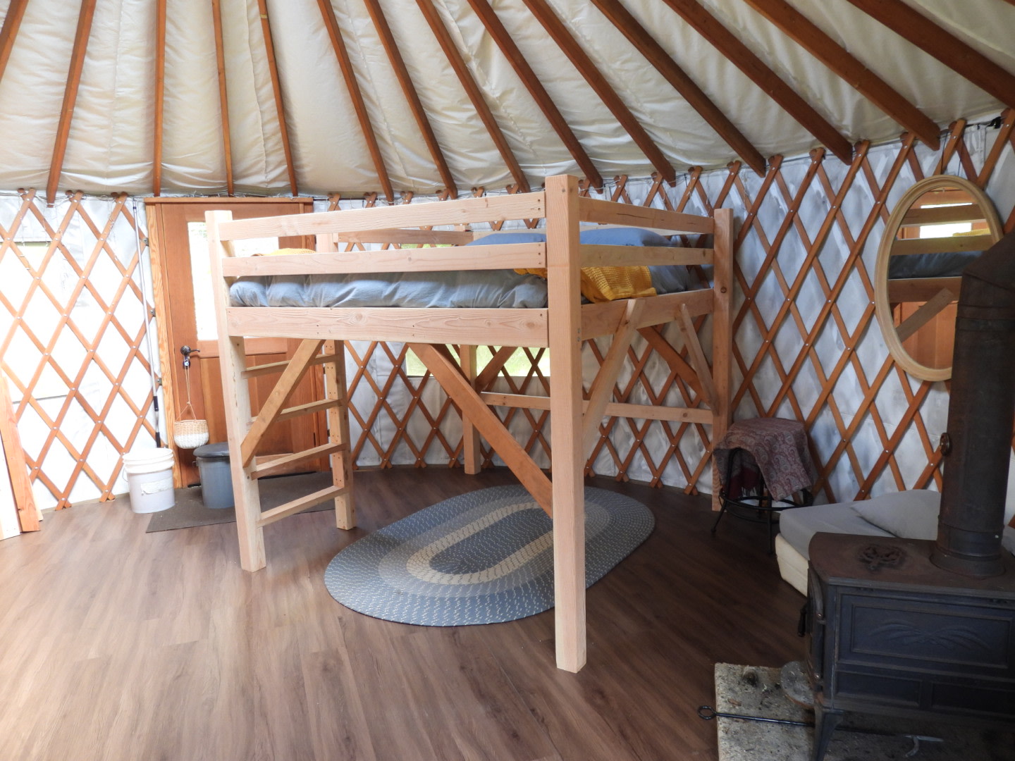 Queen loft bed, folding twin mattress also available.  Wood-stove for the winter months. 

