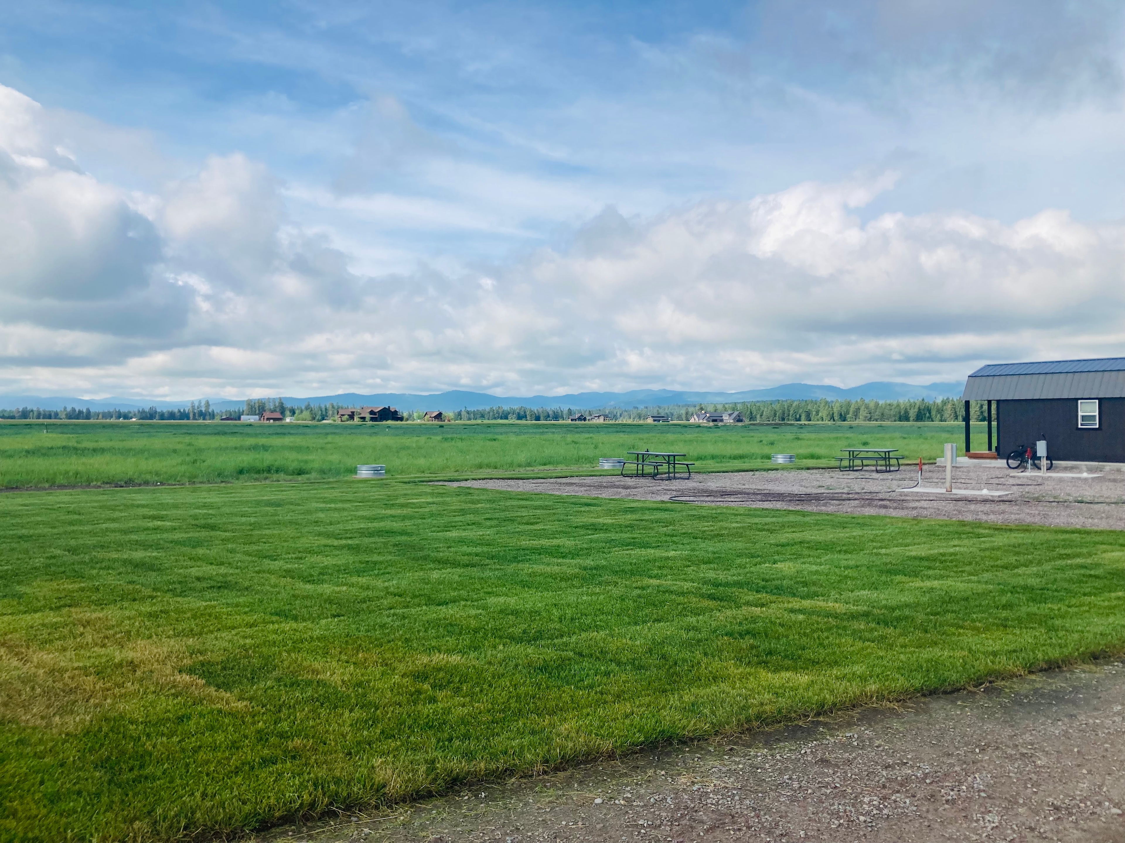 View of RV site 1 and 2.   Site 1 is nearest the large area of lawn.  Small cabin is west of RV site 2.