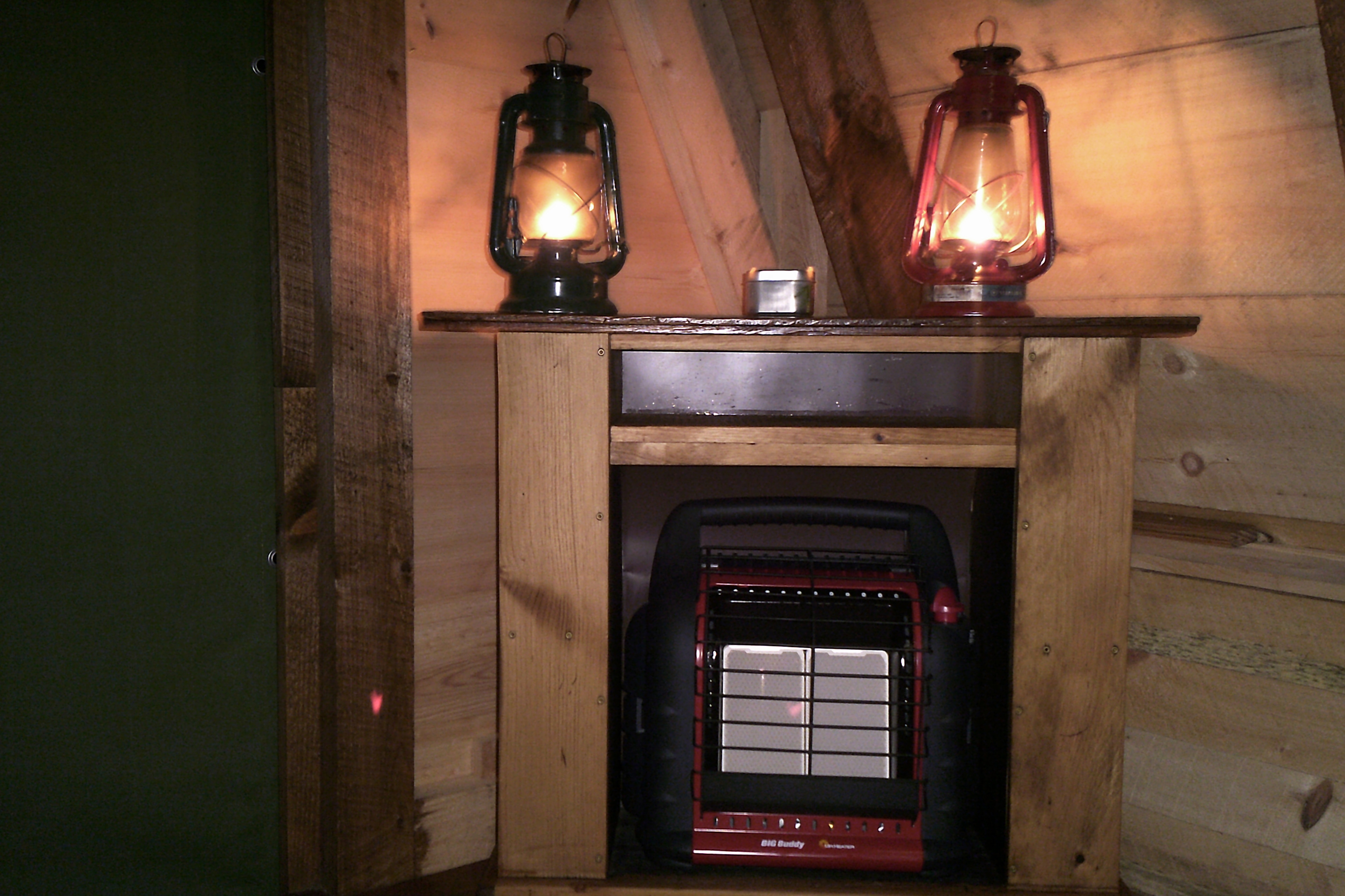 18K BTU propane space heater tucked into a cozy corner fireplace. 

