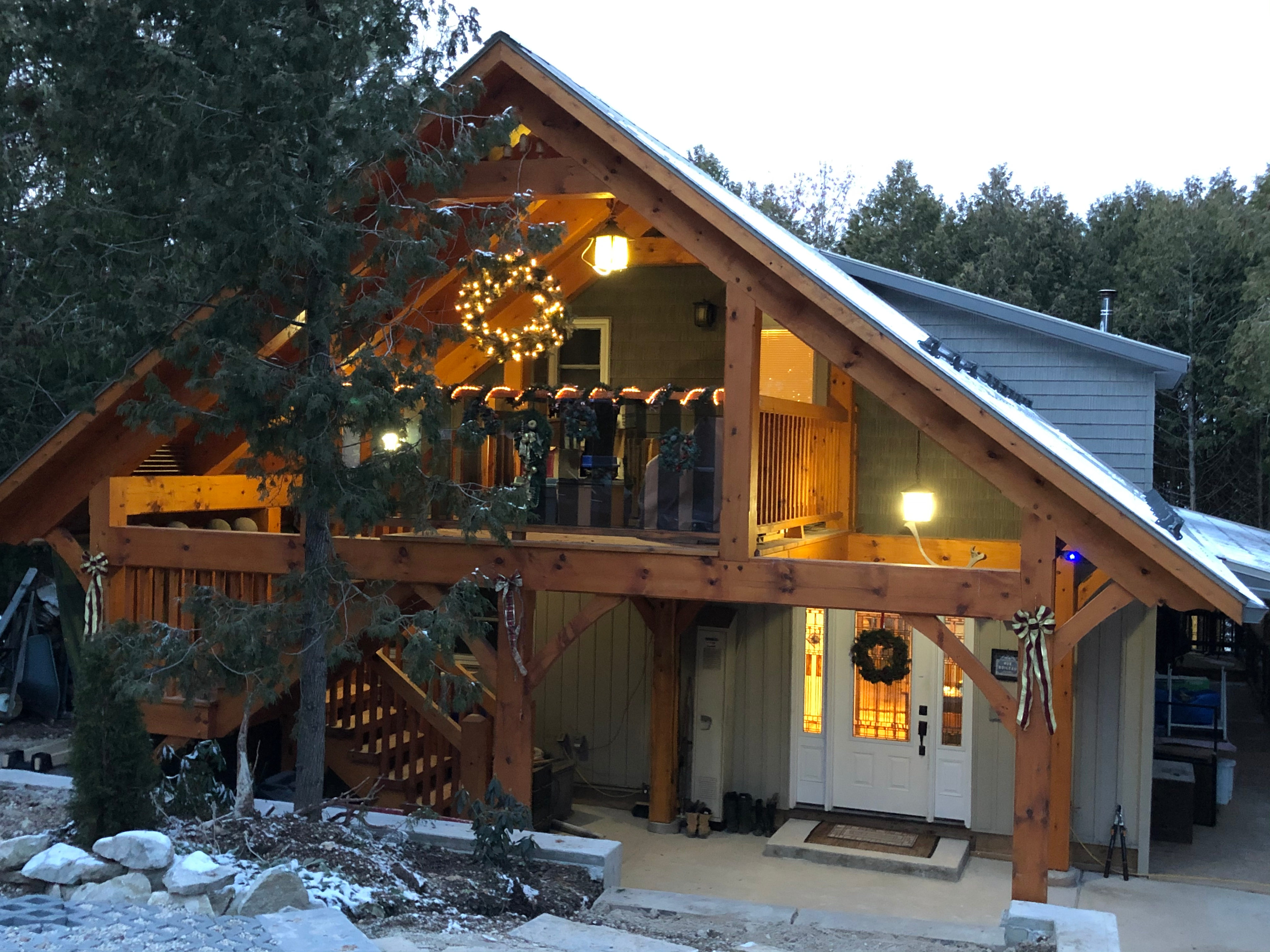 The house and view of upstairs Elvish Suite porch; house decorated for the winter season