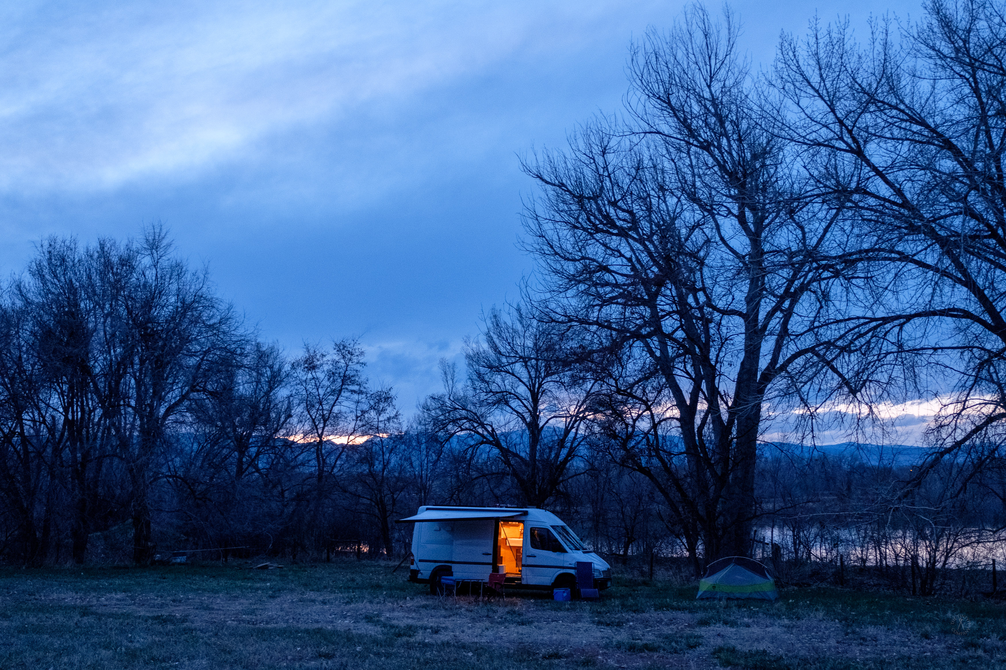 Vans and Car Camping Spot at Dusk in Winter