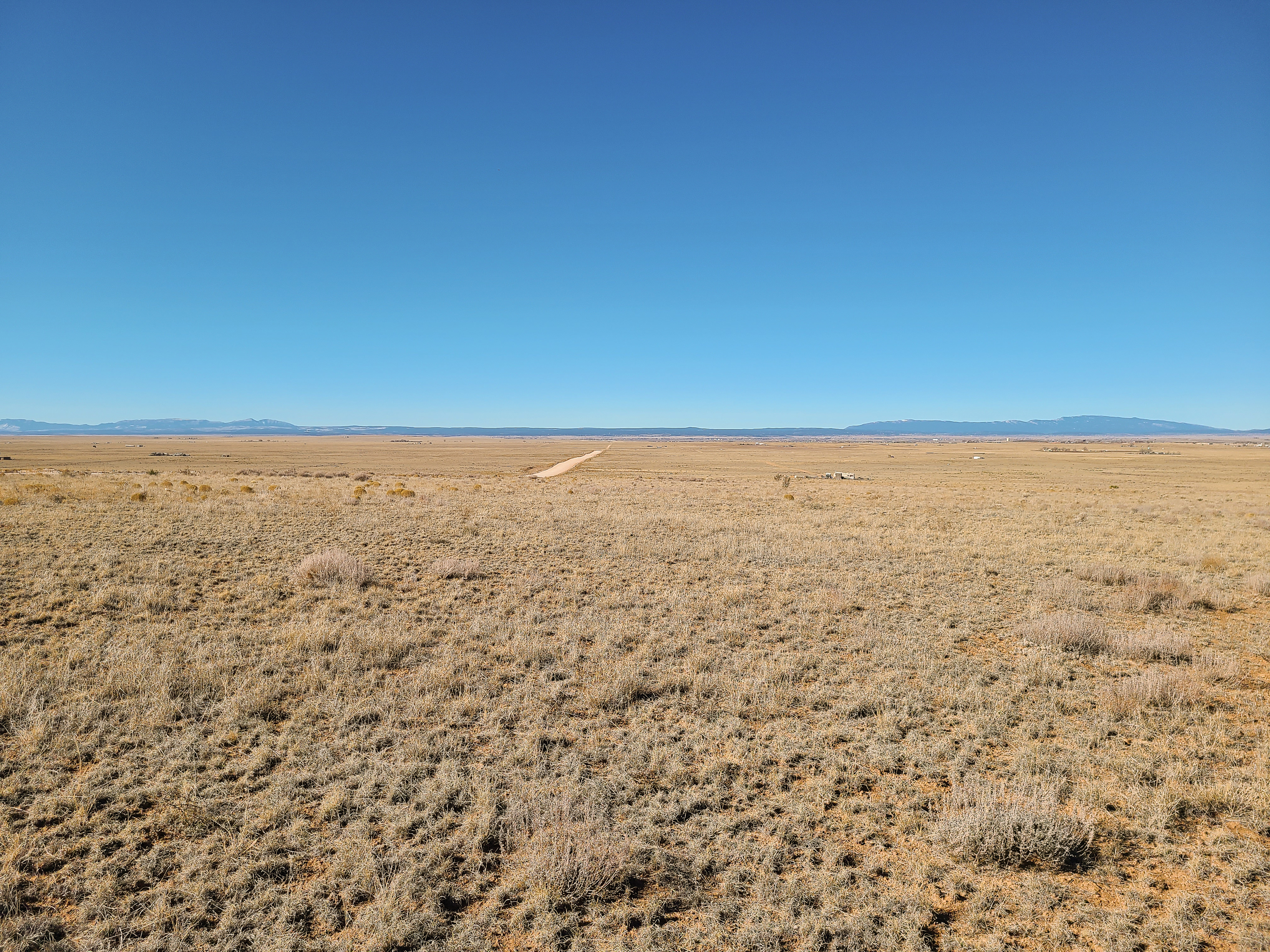 Well-maintained and wide county road in,  located just off I-40 and historic Route 66.