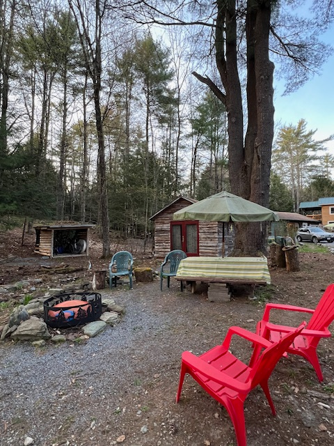 Park alongside this site, enjoy a nice fire, all set up next to the cabin we call "Musket Hill,"  Camp cooking gear and extra chairs in the cabin.  The bike garage will keep your bike dry.  