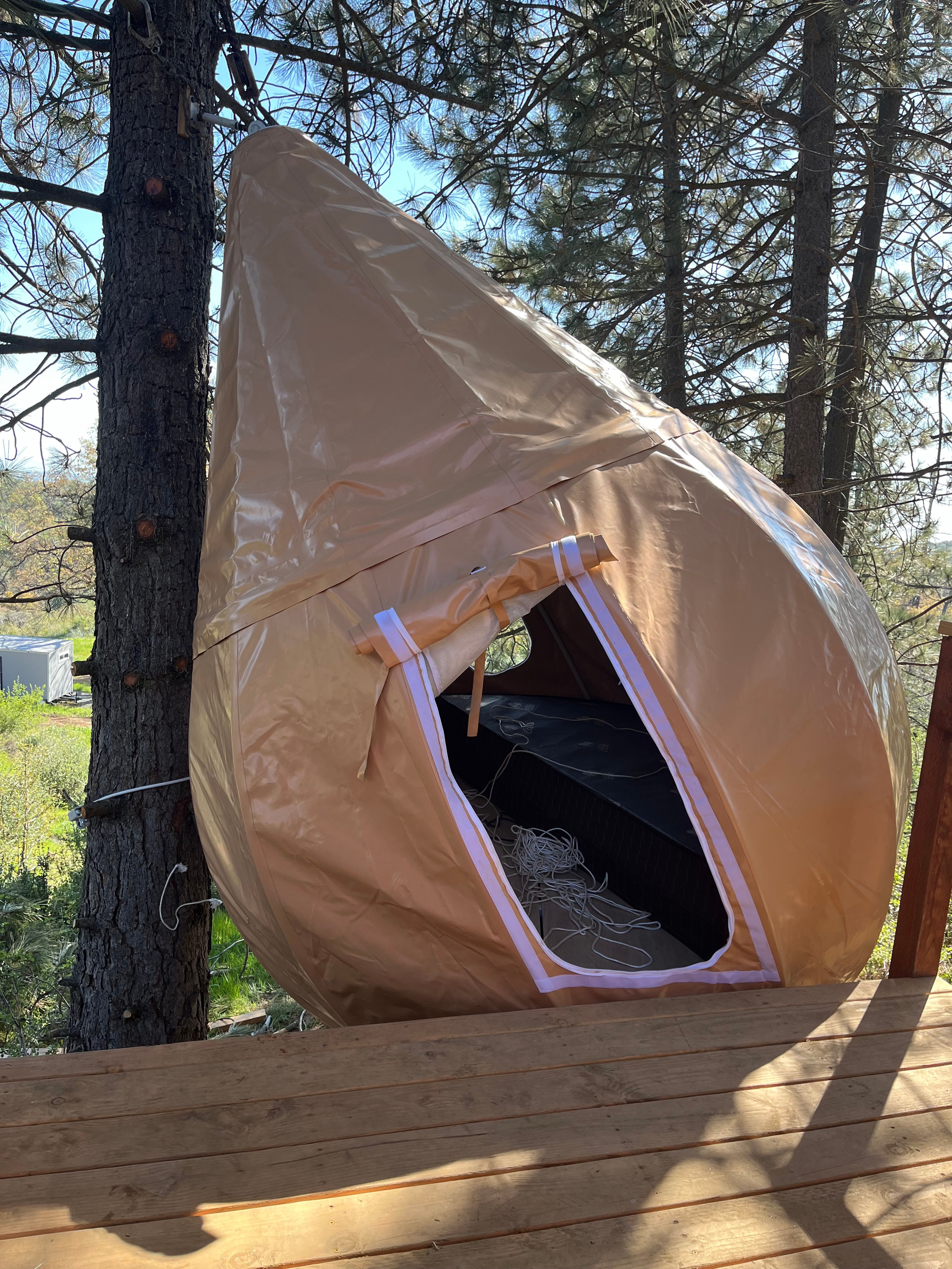There is a round California king-size bed in the tent, anyone that is under 6' 5" will have no problems standing in the tent. 