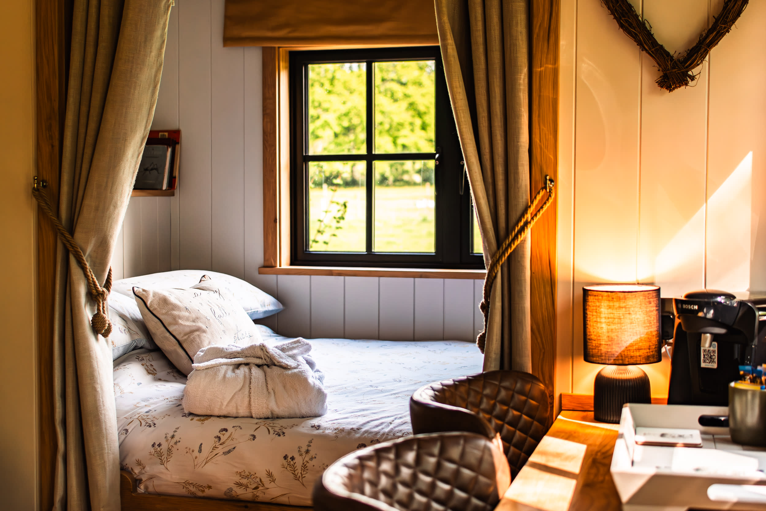 The bed and seating / dining area inside the hut.