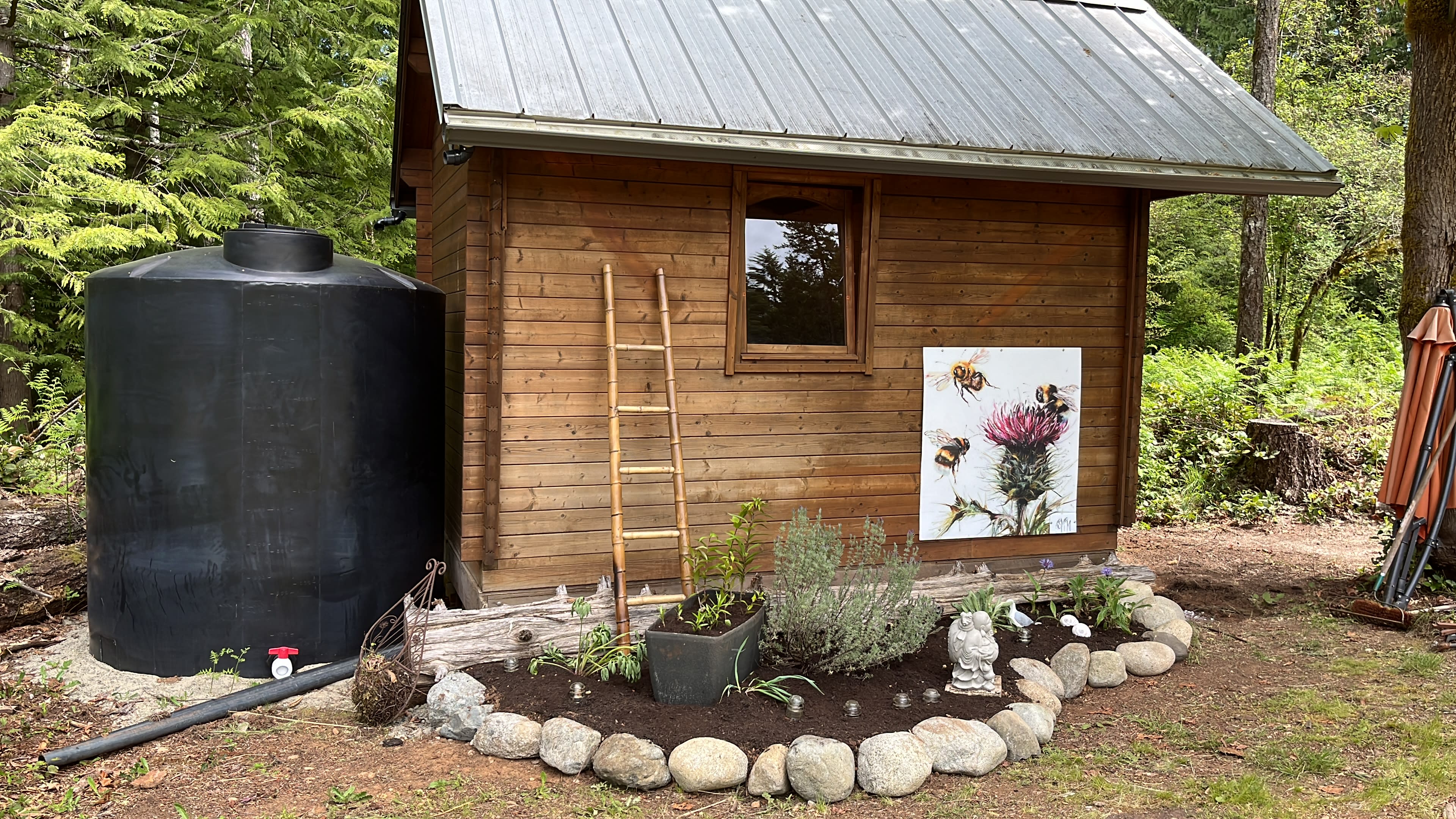 Putting the final touches to the cabin garden.