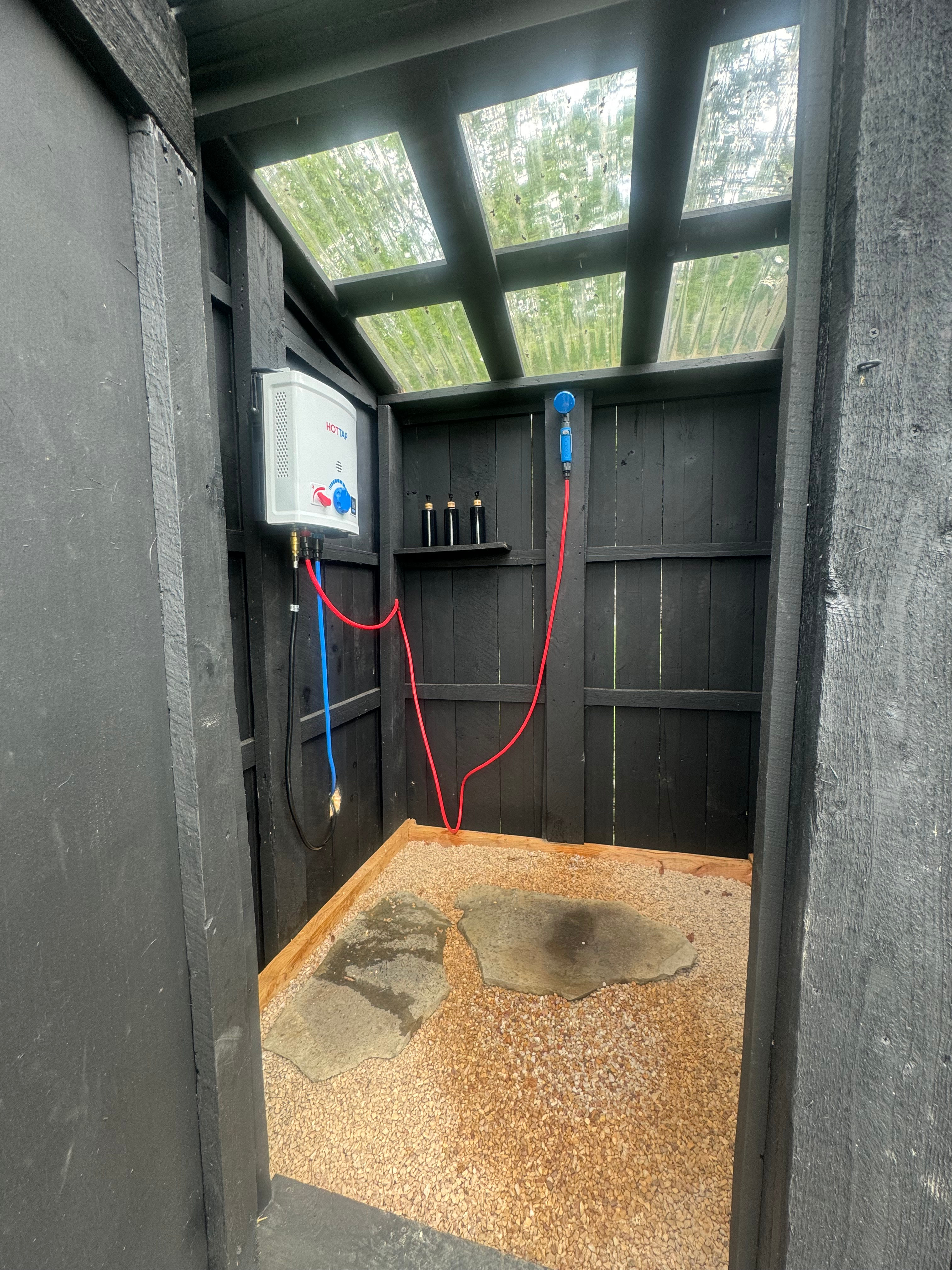 Shower is seasonally available. You must have access to a car lighter or portable battery that fits a cigarette lighter plug in fitting to operate shower. This is a self use service and open to all campers. 