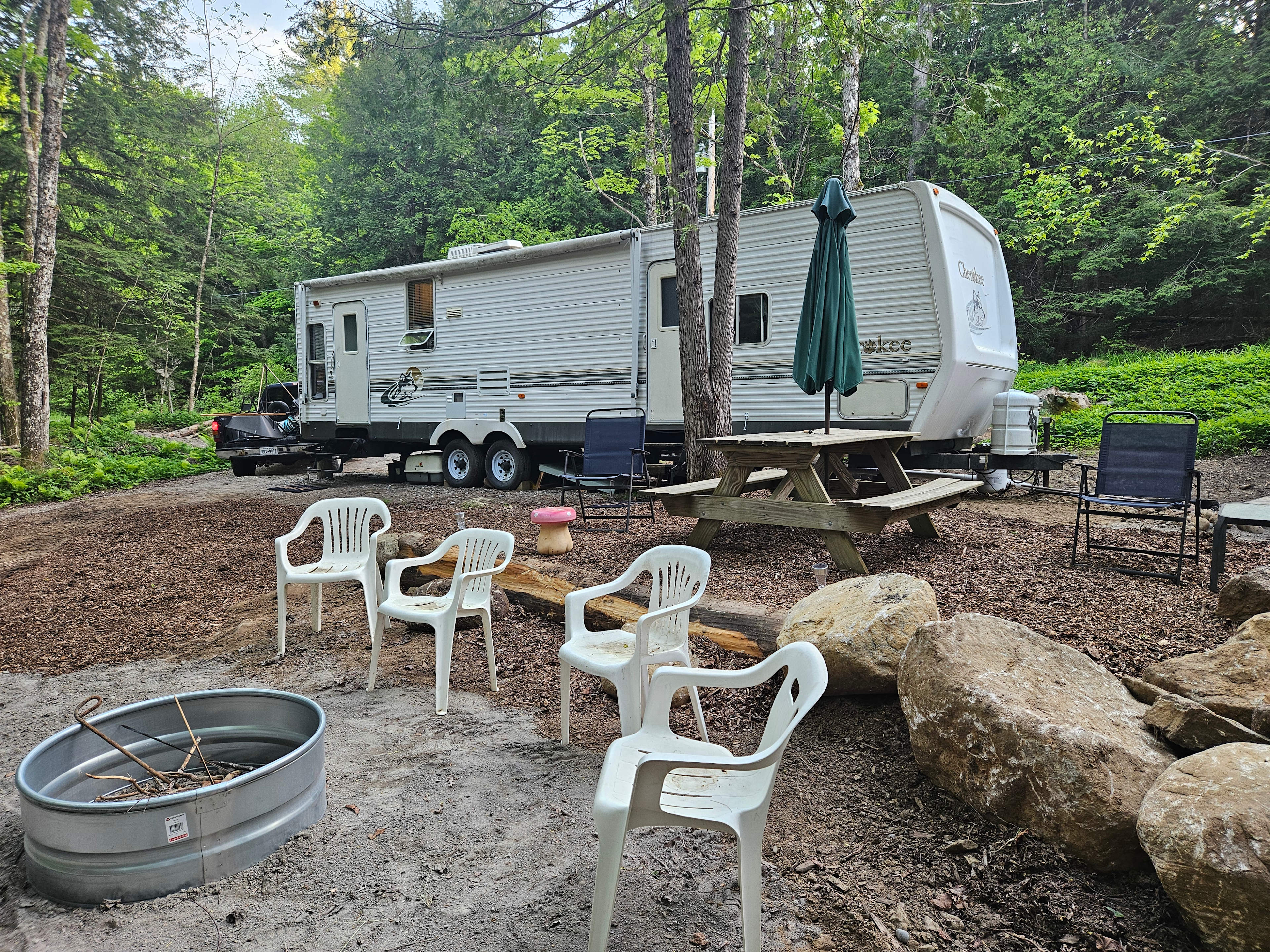 New Location with a river view.  Fire pit and picnic area