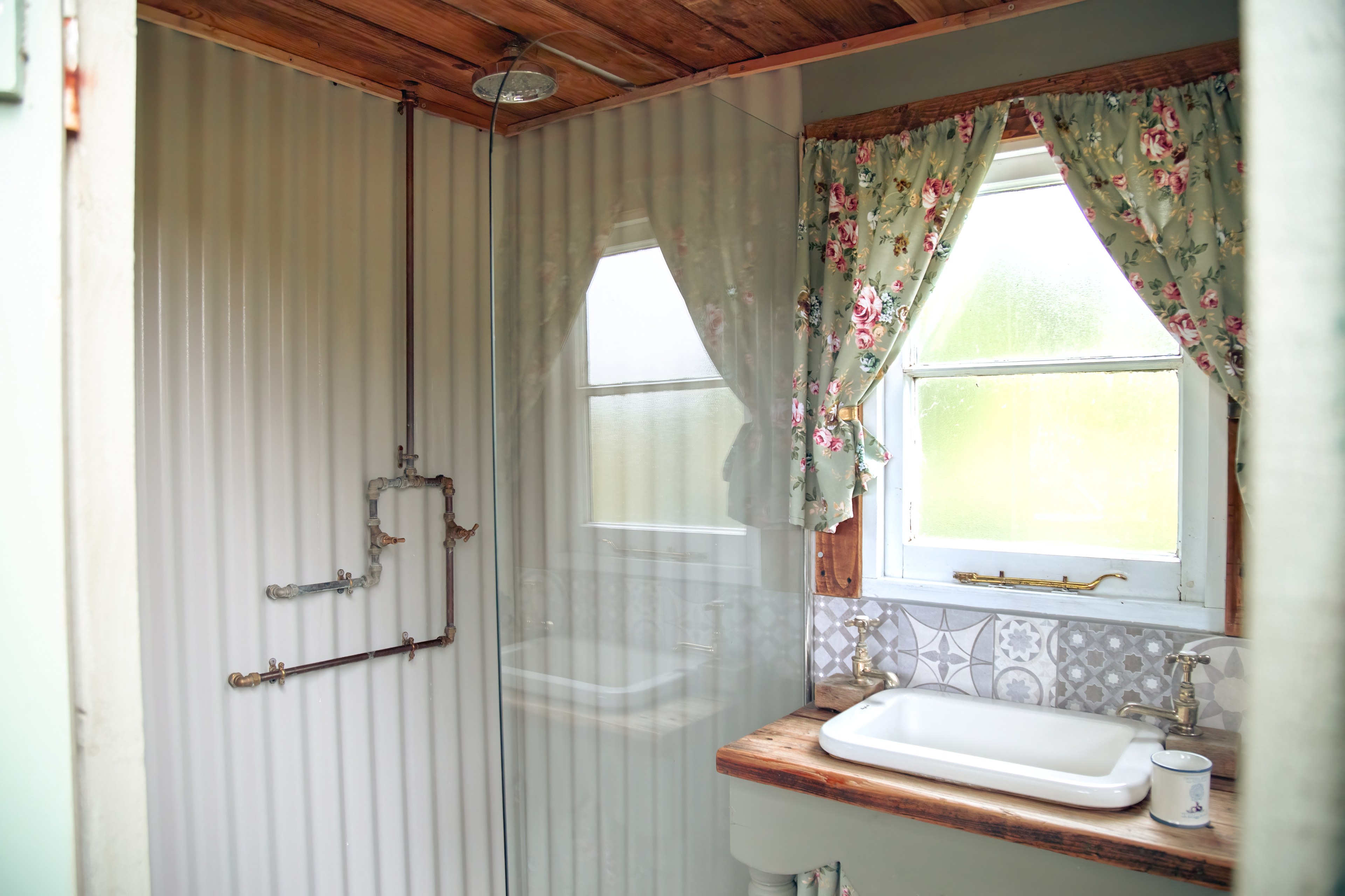 Water to the basin and shower is hot and heated by a LPG gas heater.