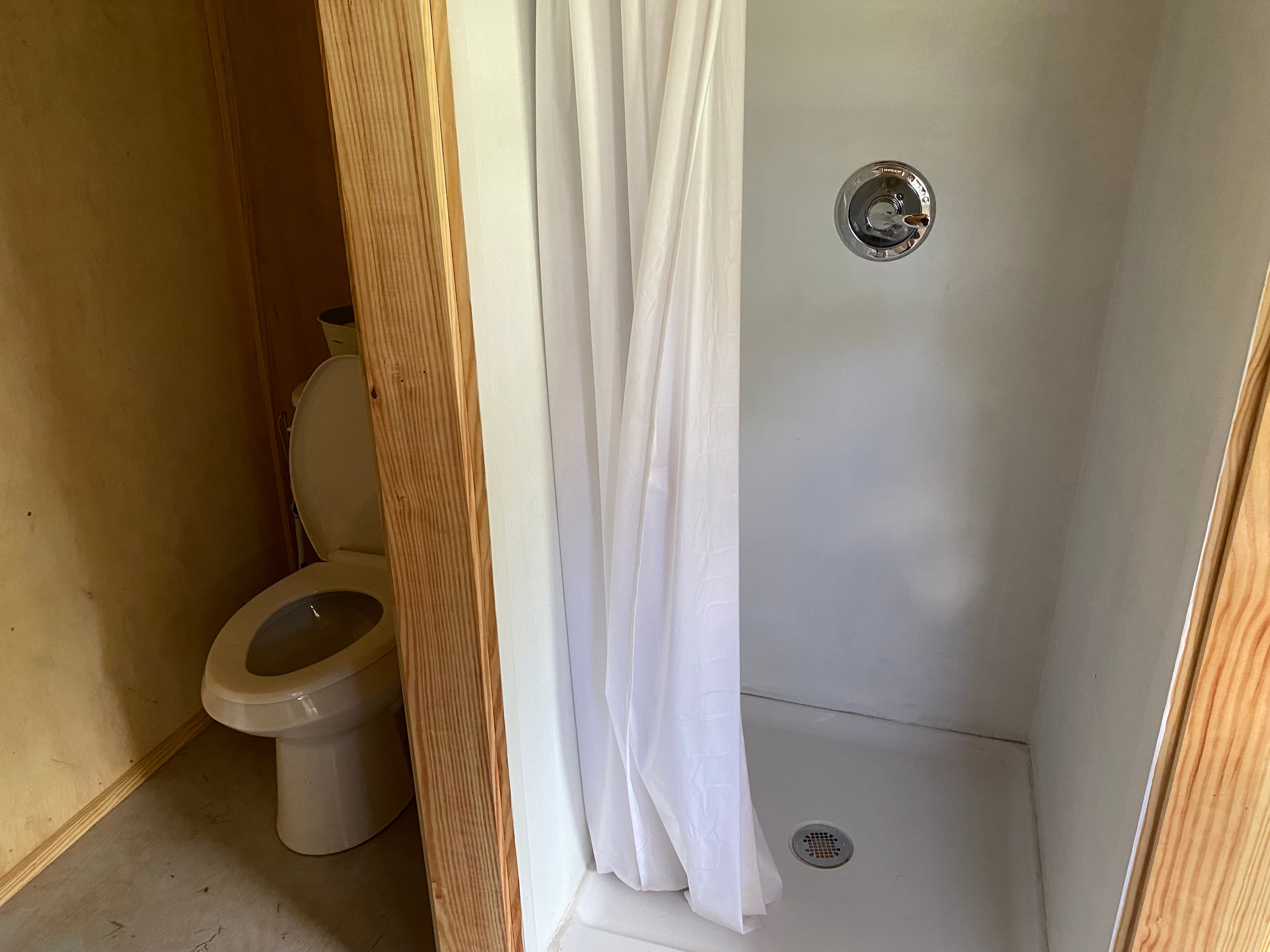 The little bath house even has towels for guests