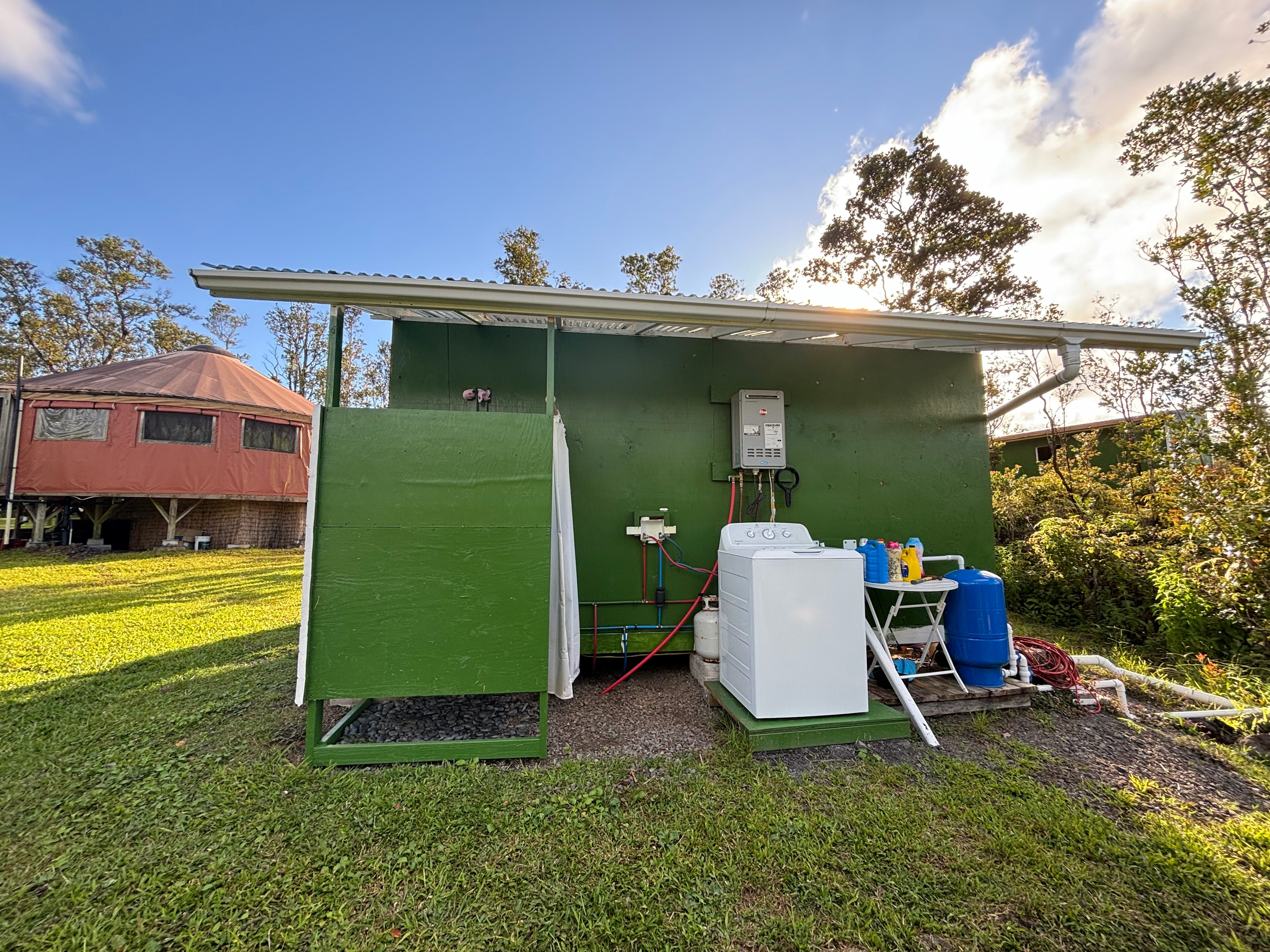 The outdoor shower area (the yurt has an indoor shower) and the washing machine machine.